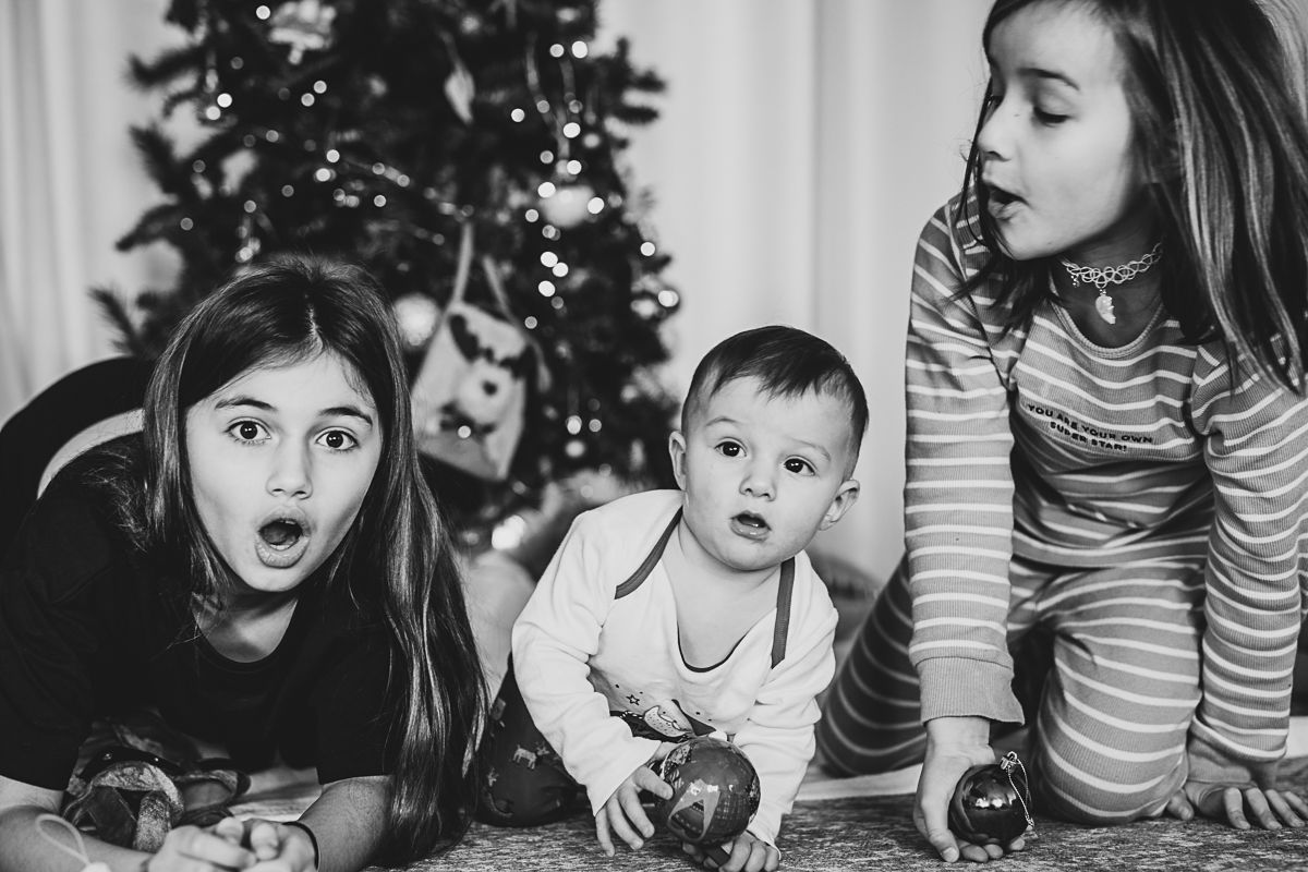 Natural light family photographer in Dundee and Angus capturing real moments during a home photoshoot at Christmas period