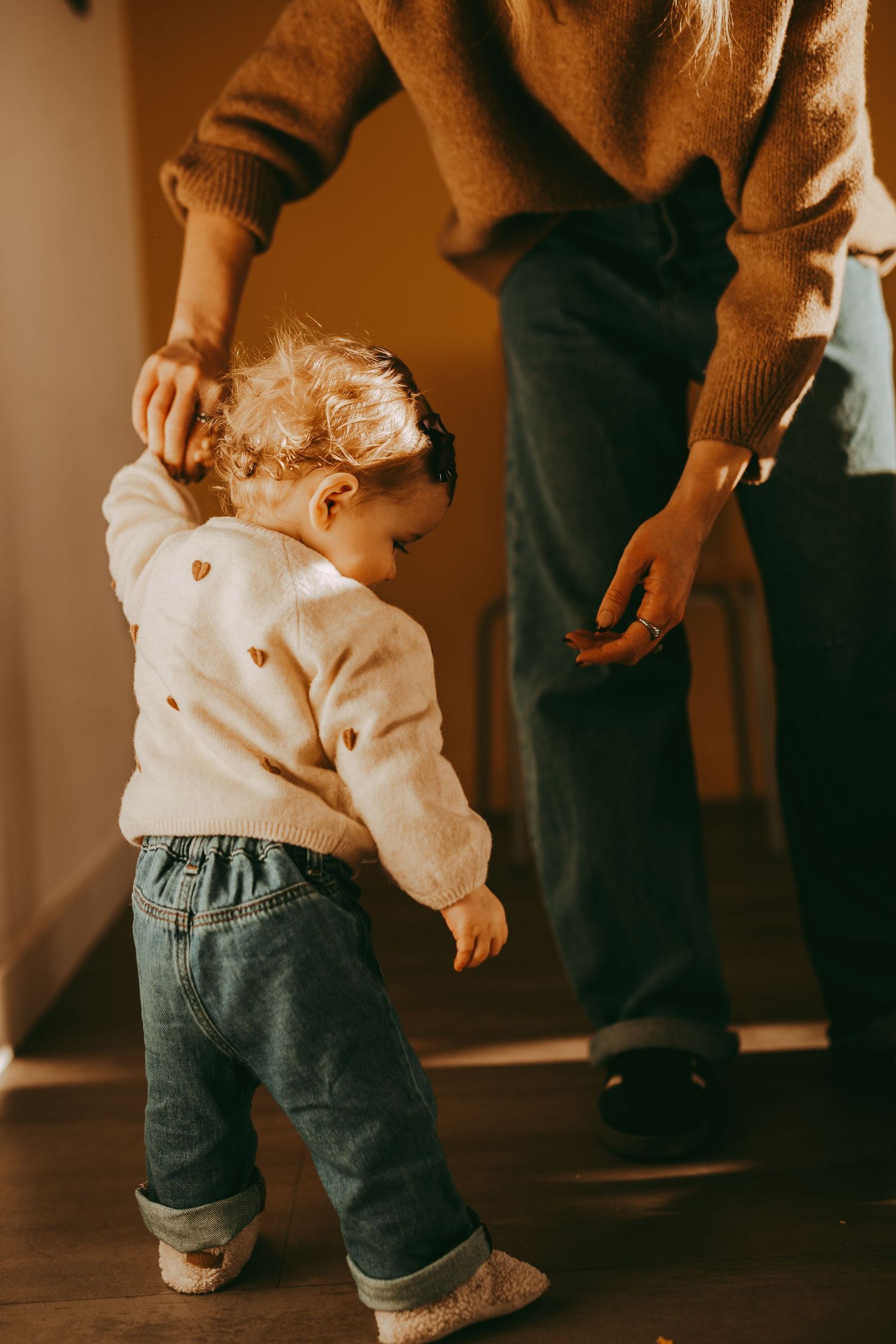 Candid moment between mother and daughter during home photoshoot in Angus