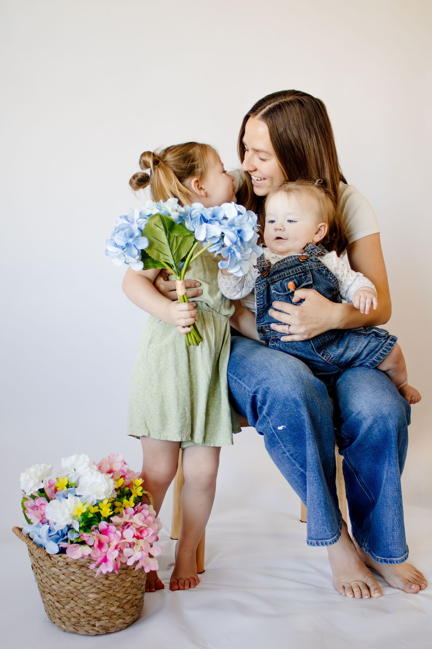 Motherhood studio photography session in florence arizona. Light and airy motherhood photography. Candid motherhood photos