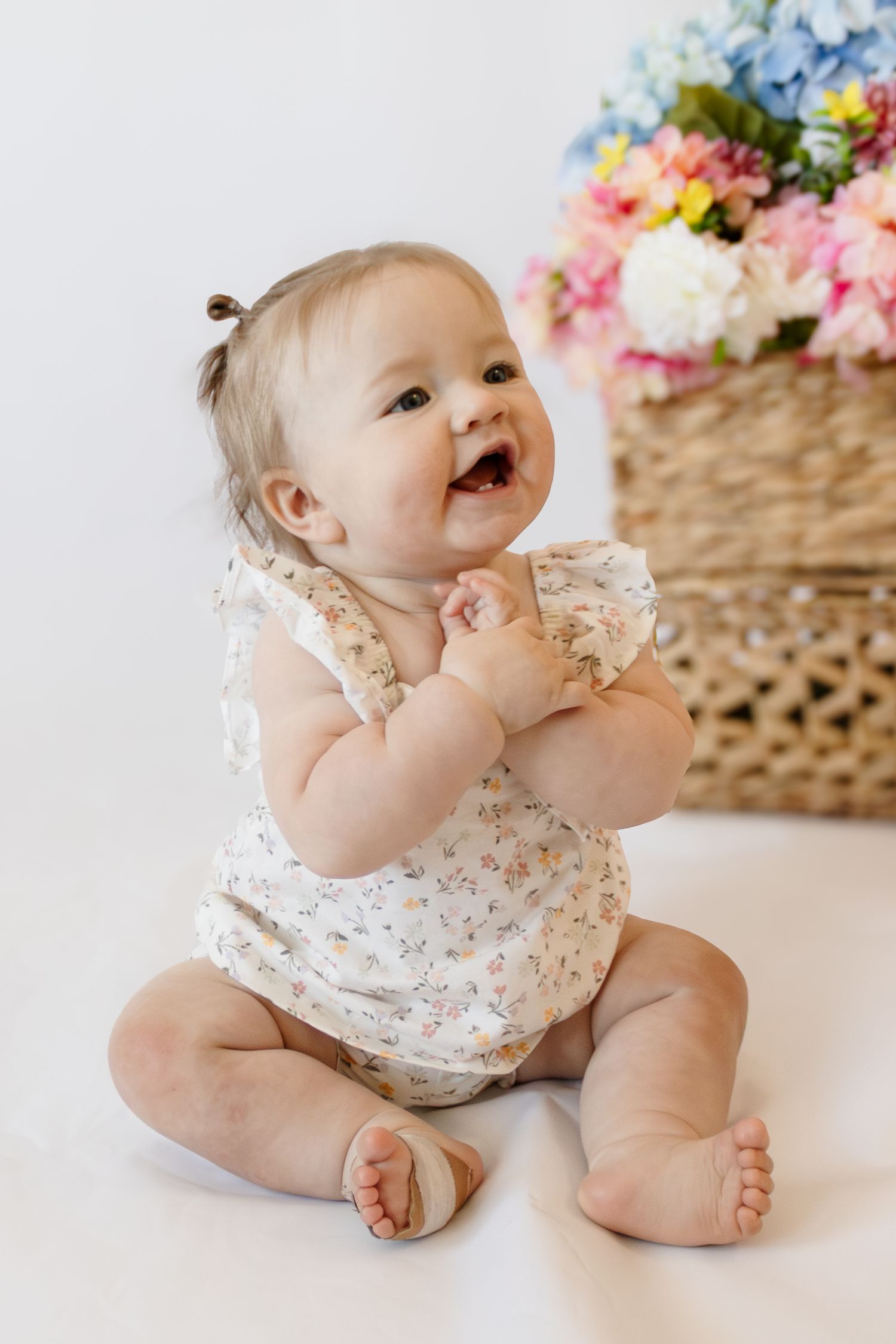 Baby milestone photography session in florence or coolidge arizona. Clapping baby in a portrait photo backdrop in AZ