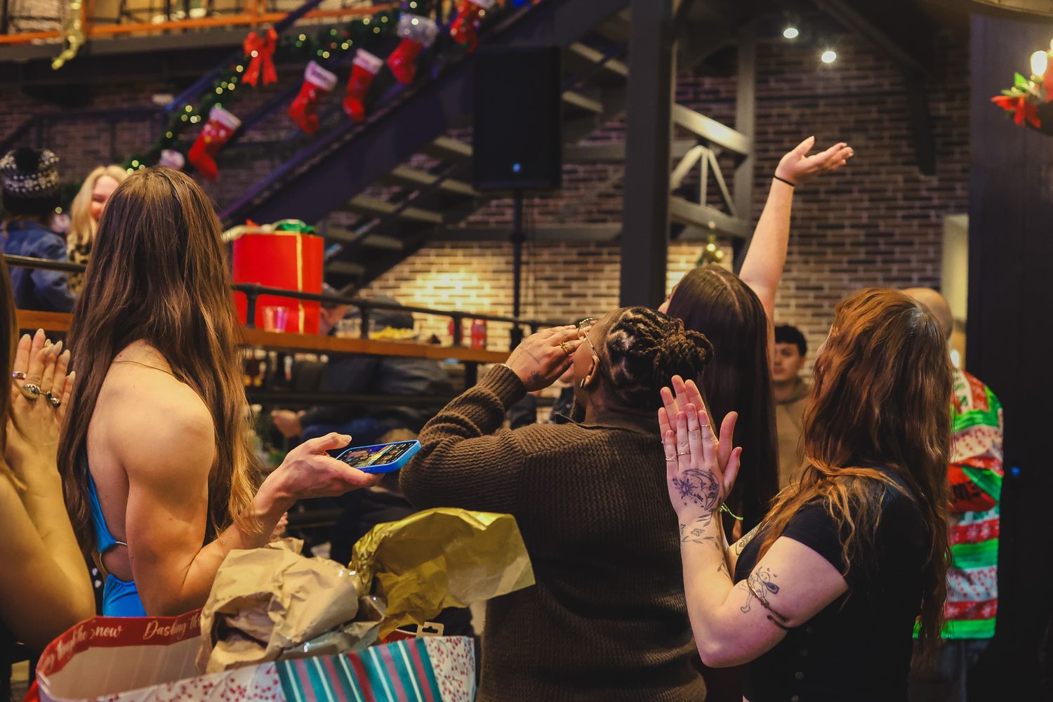 Group of women celebrating at festive Christmas holiday party event.