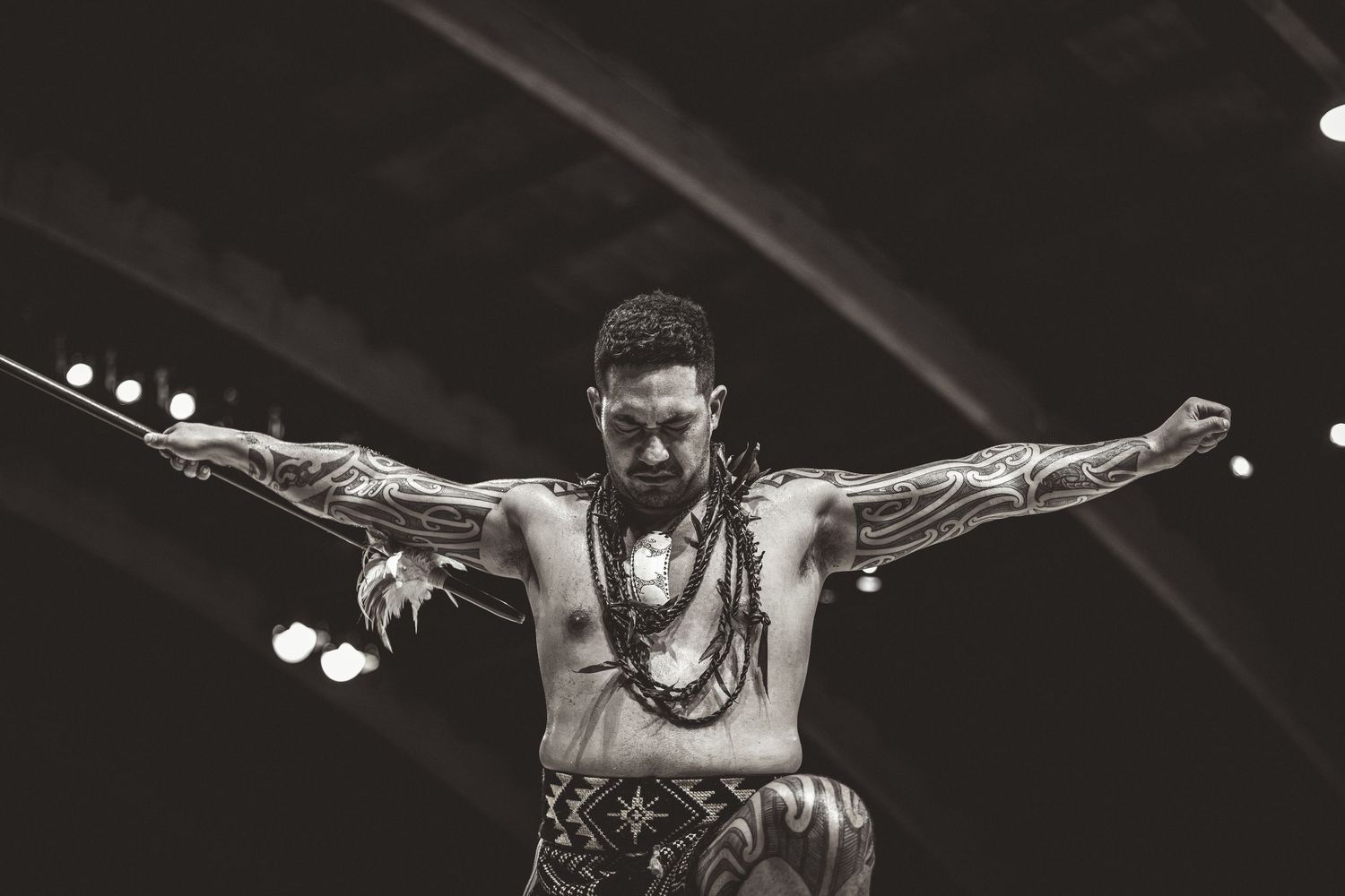 Dynamic black and white performance shots showing dramatic stage lighting and expressive movements.