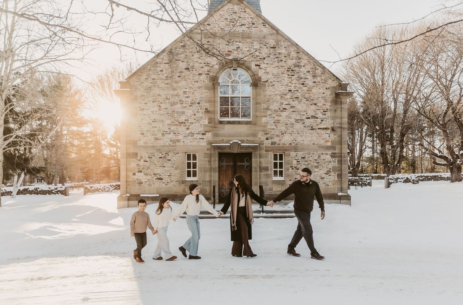 Moncton New Brunswick Maternity & Newborn photography family in front of old church holding hands golden hour