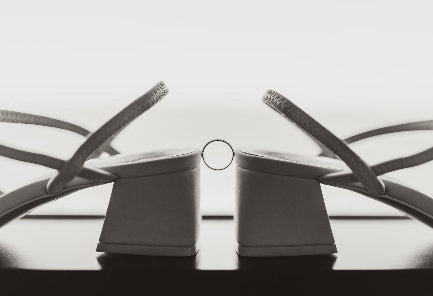 detailed black and white image of bride's ring
