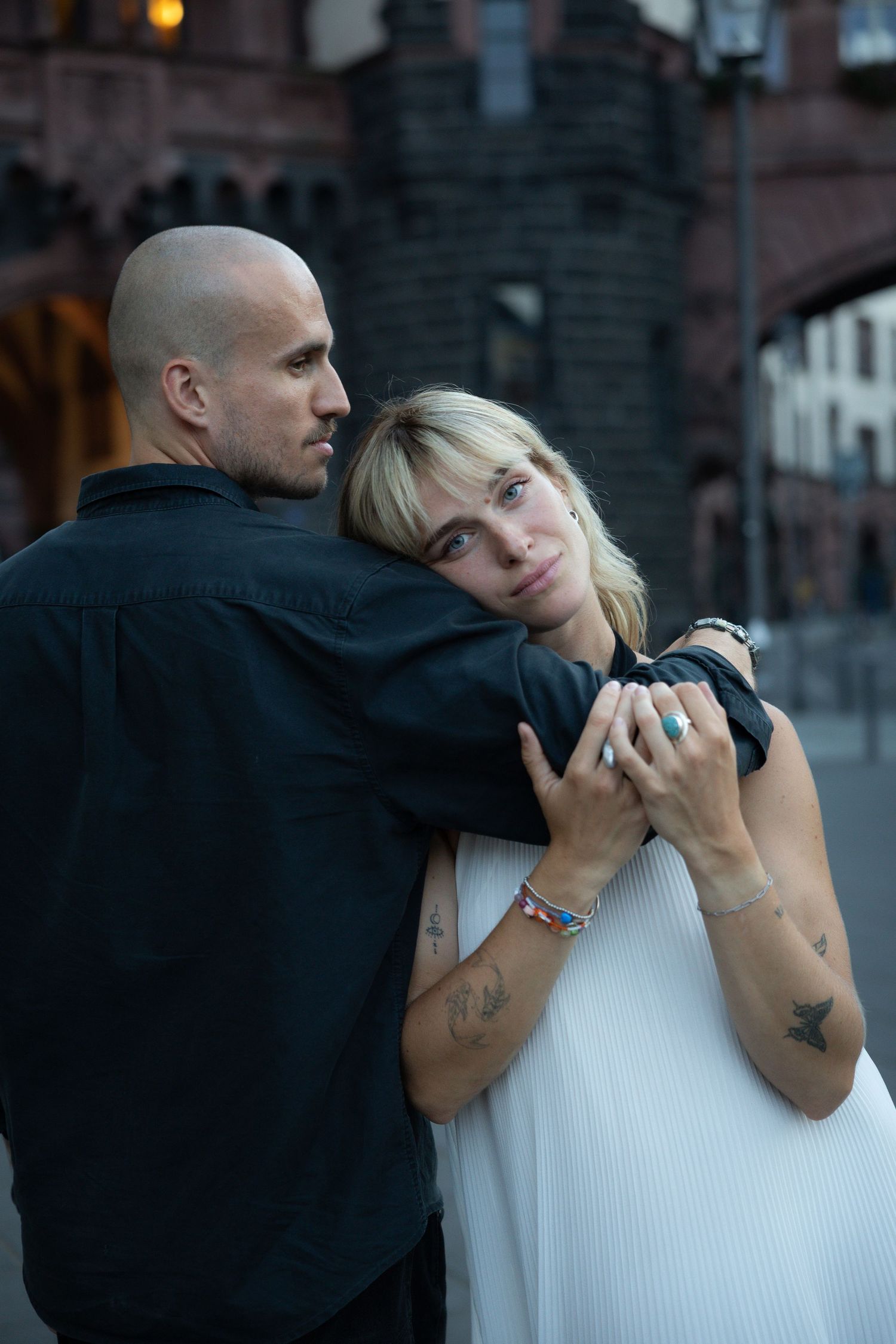 Couple posing playfully together in the city