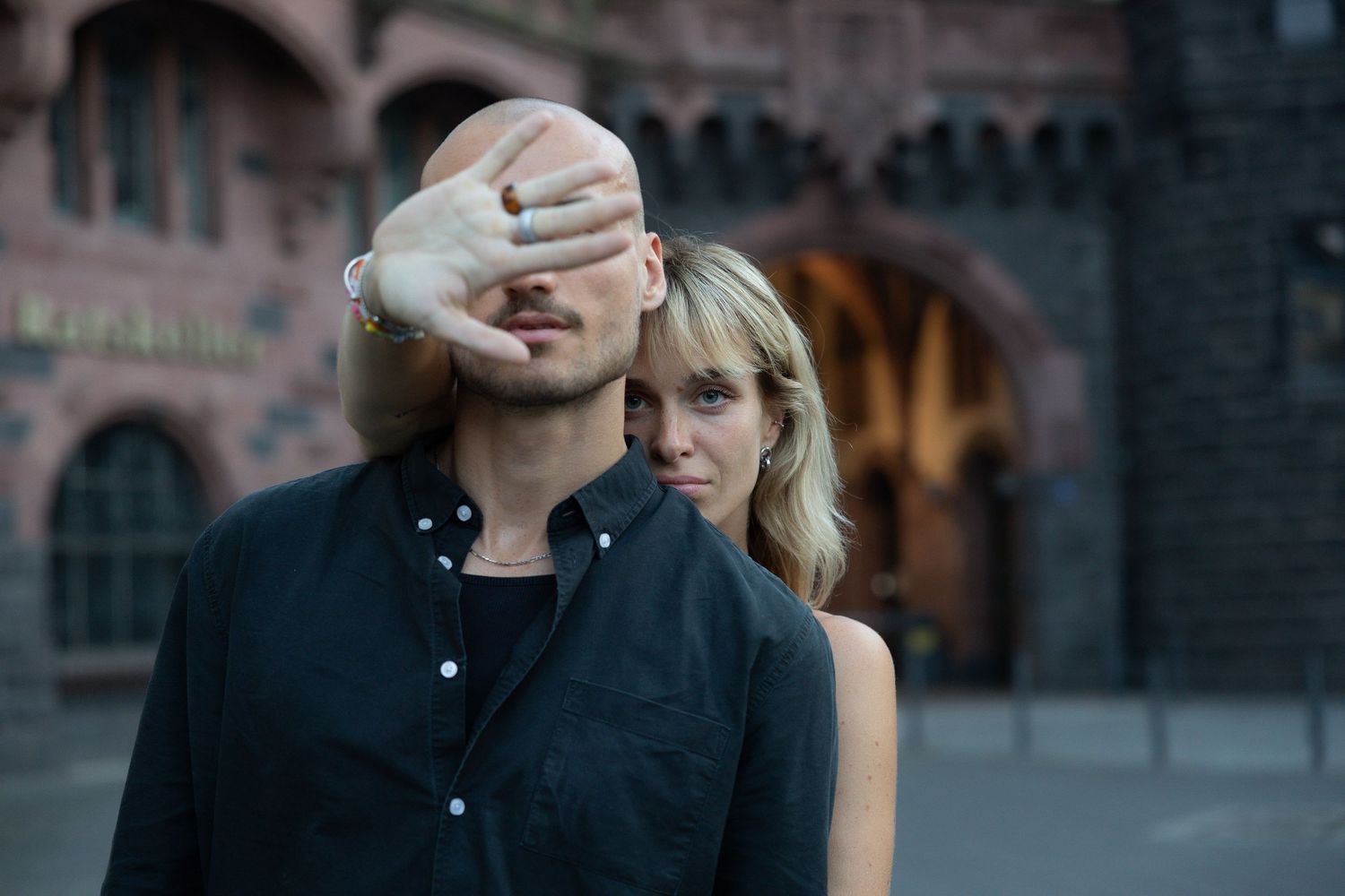 Couple posing playfully together in the city