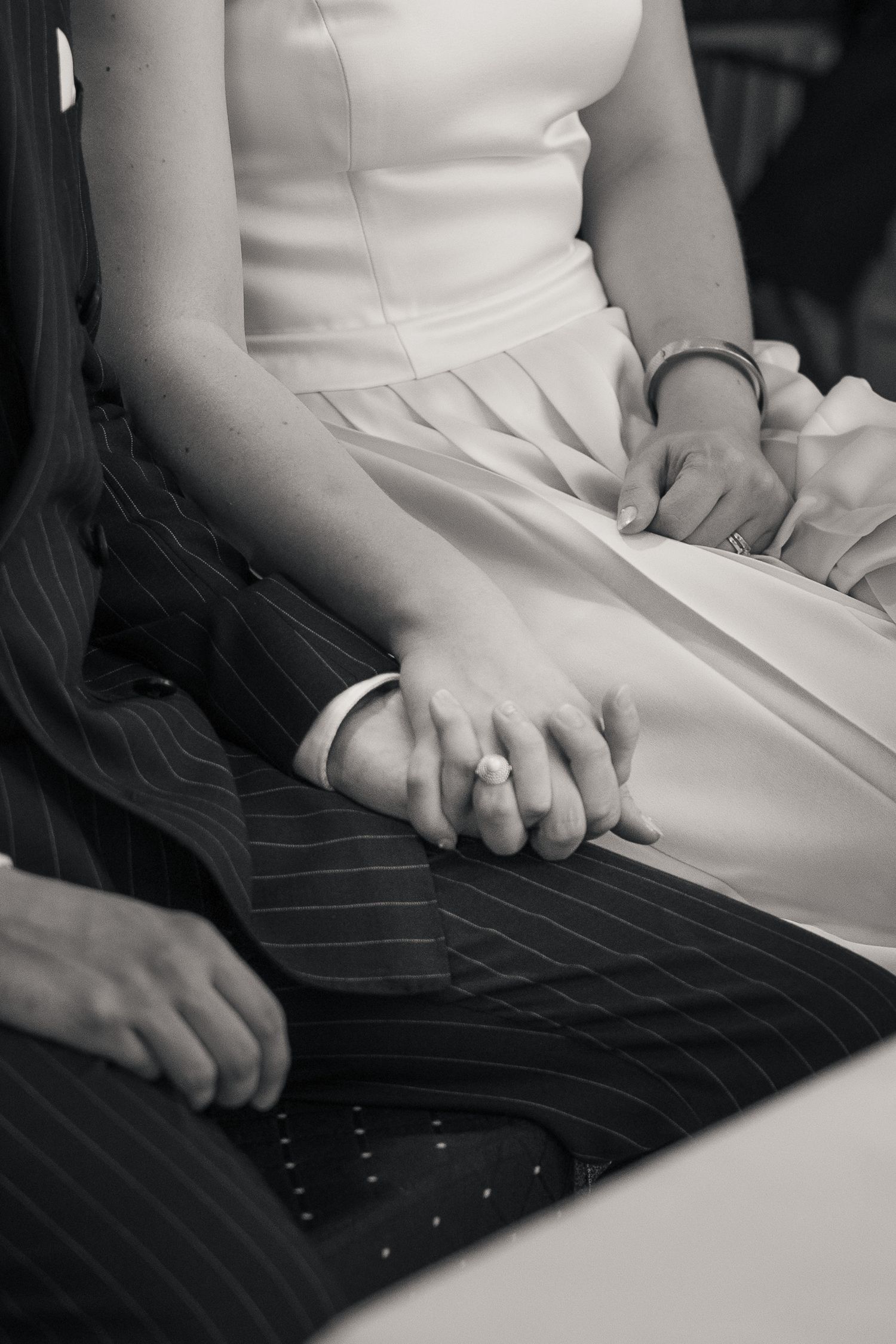 Newlyweds holding hands during civil wedding ceremony