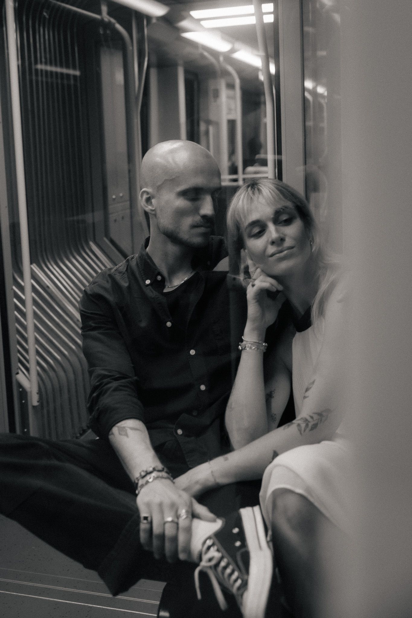 Couple sitting together on a city train