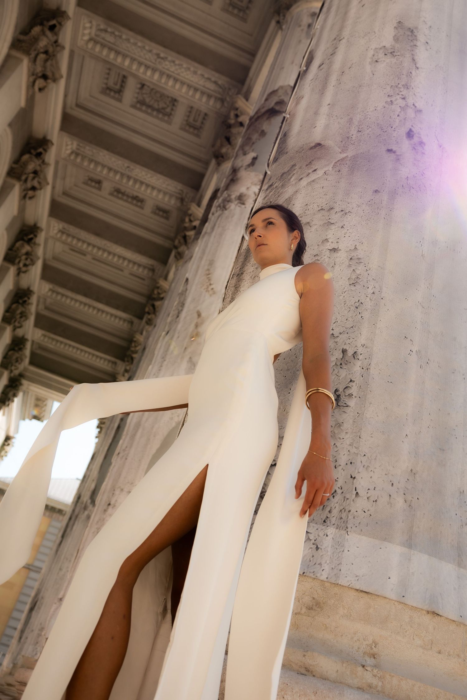 Bride is wearing a white dress and is photographed in Munich during golden hour