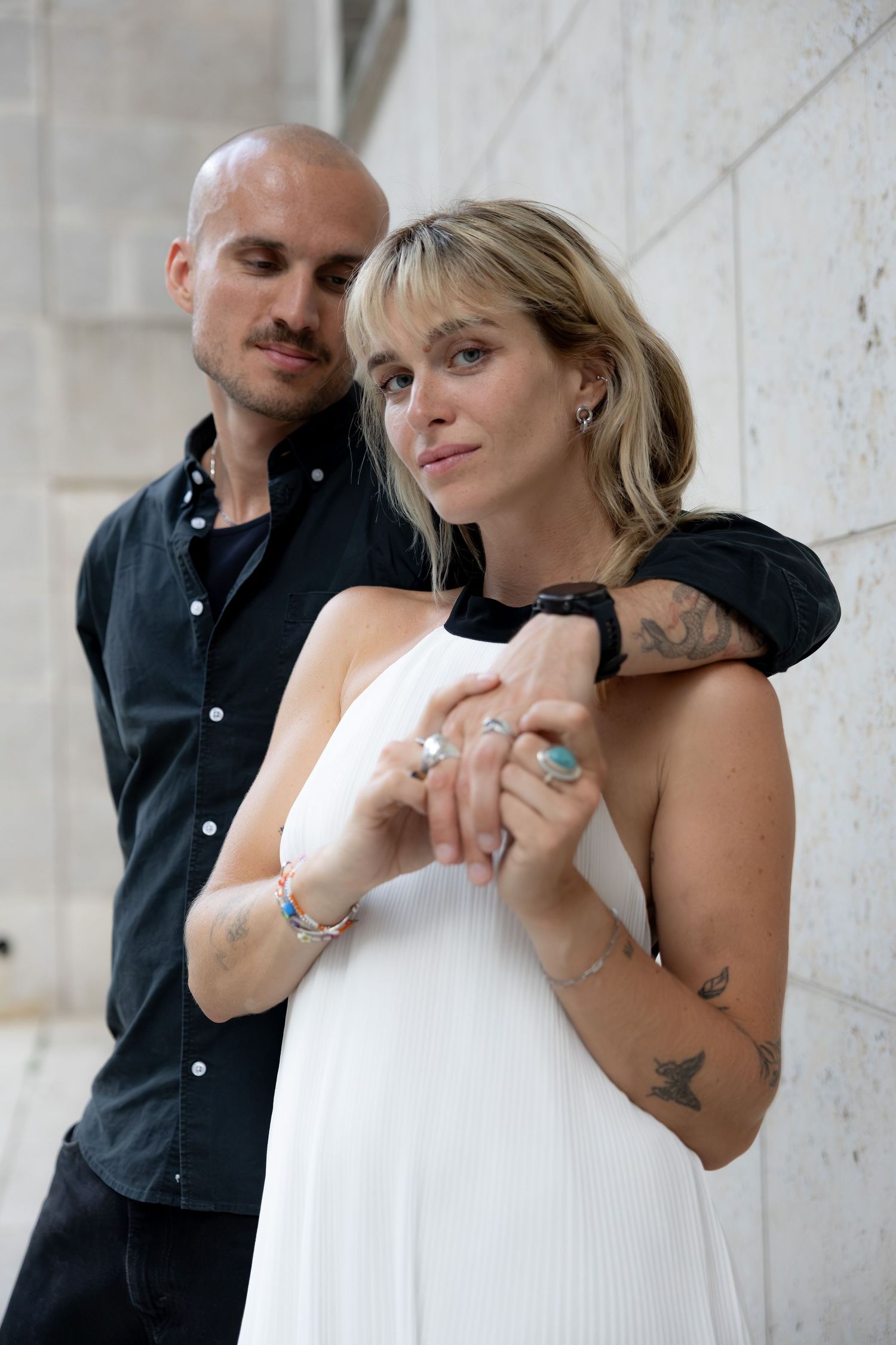 Couple posing playfully together in the city