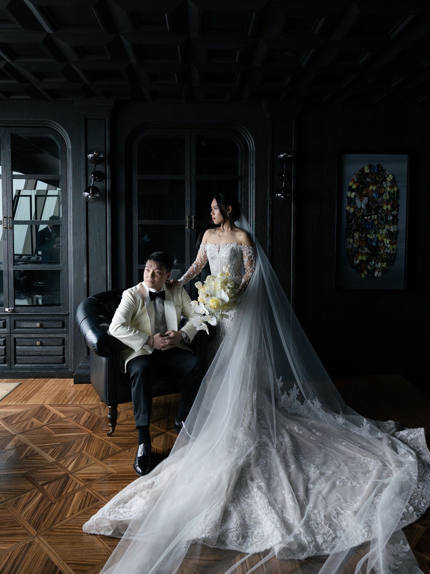 Couple embracing in dark hallway: Intimate, elegant coverage of local Manila weddings with a sophisticated editorial flair.