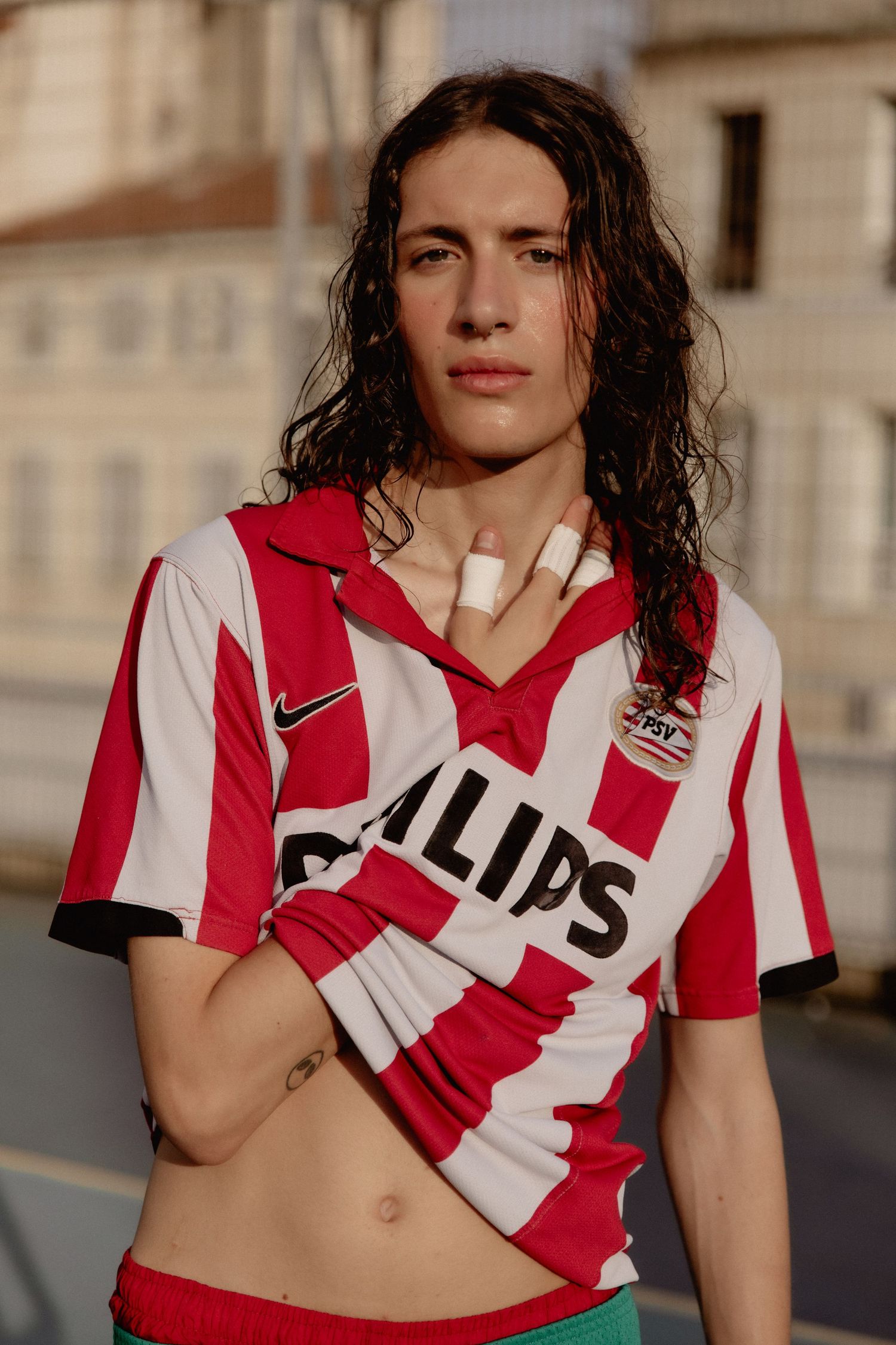 Person wearing red and white striped athletic jersey posing in multiple cropped shots outdoors.