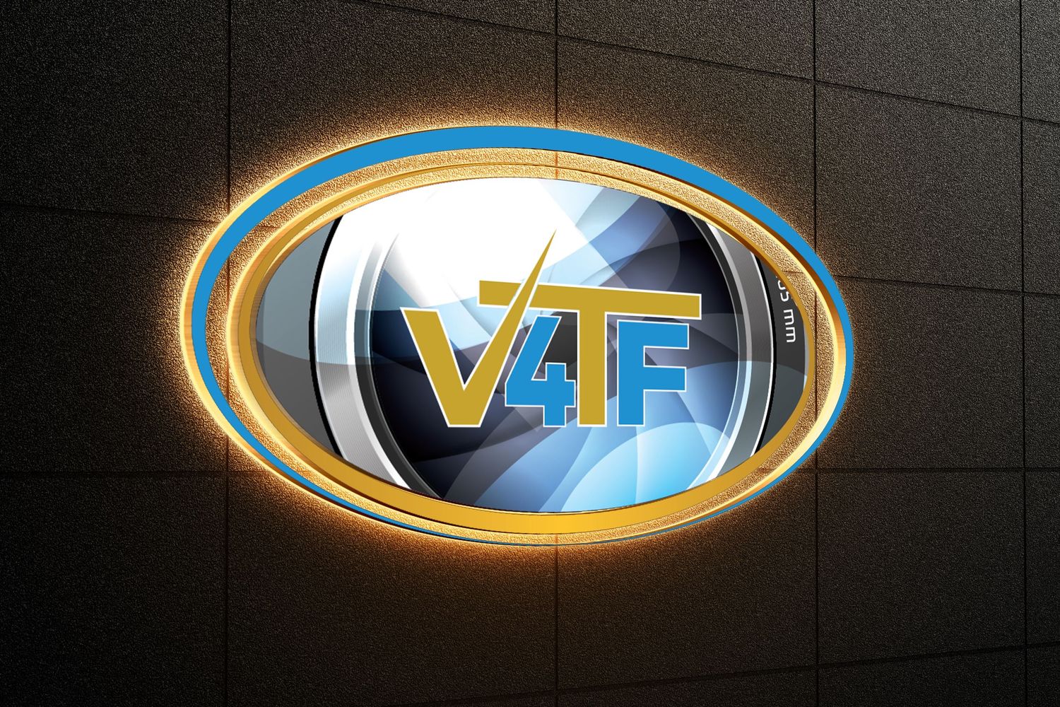 Illuminated V4F logo design with metallic chrome finish and glowing orange ring effect on dark wall.