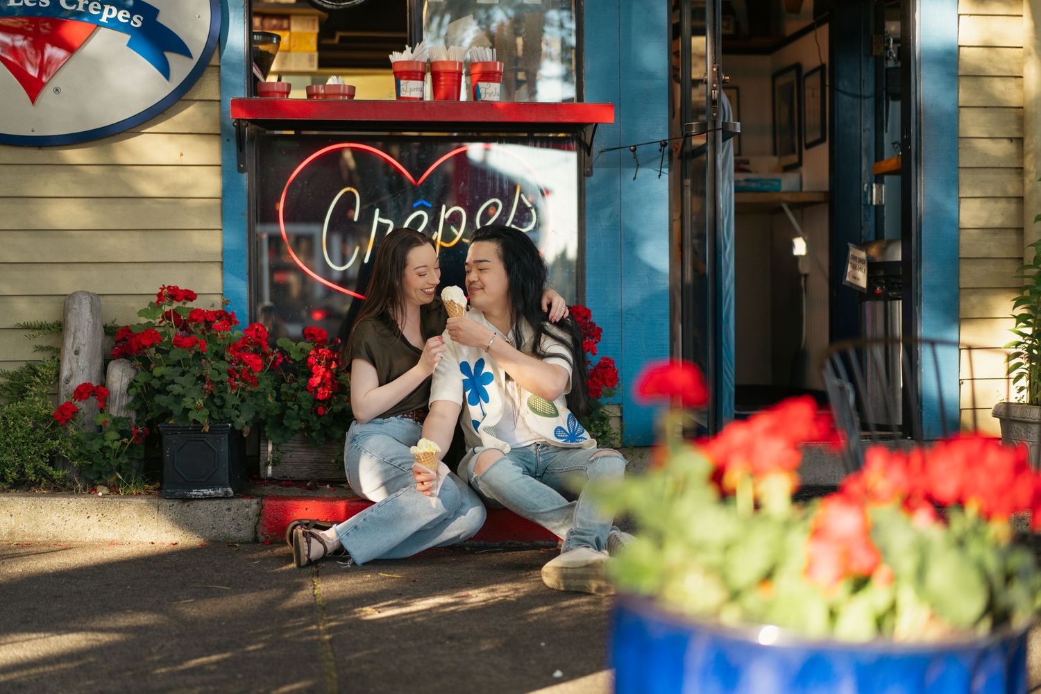 A couple sharing an ice cream in Kingston WA during engagement photography, Captured by Savvy Photography - Seattle Wedding Photographer