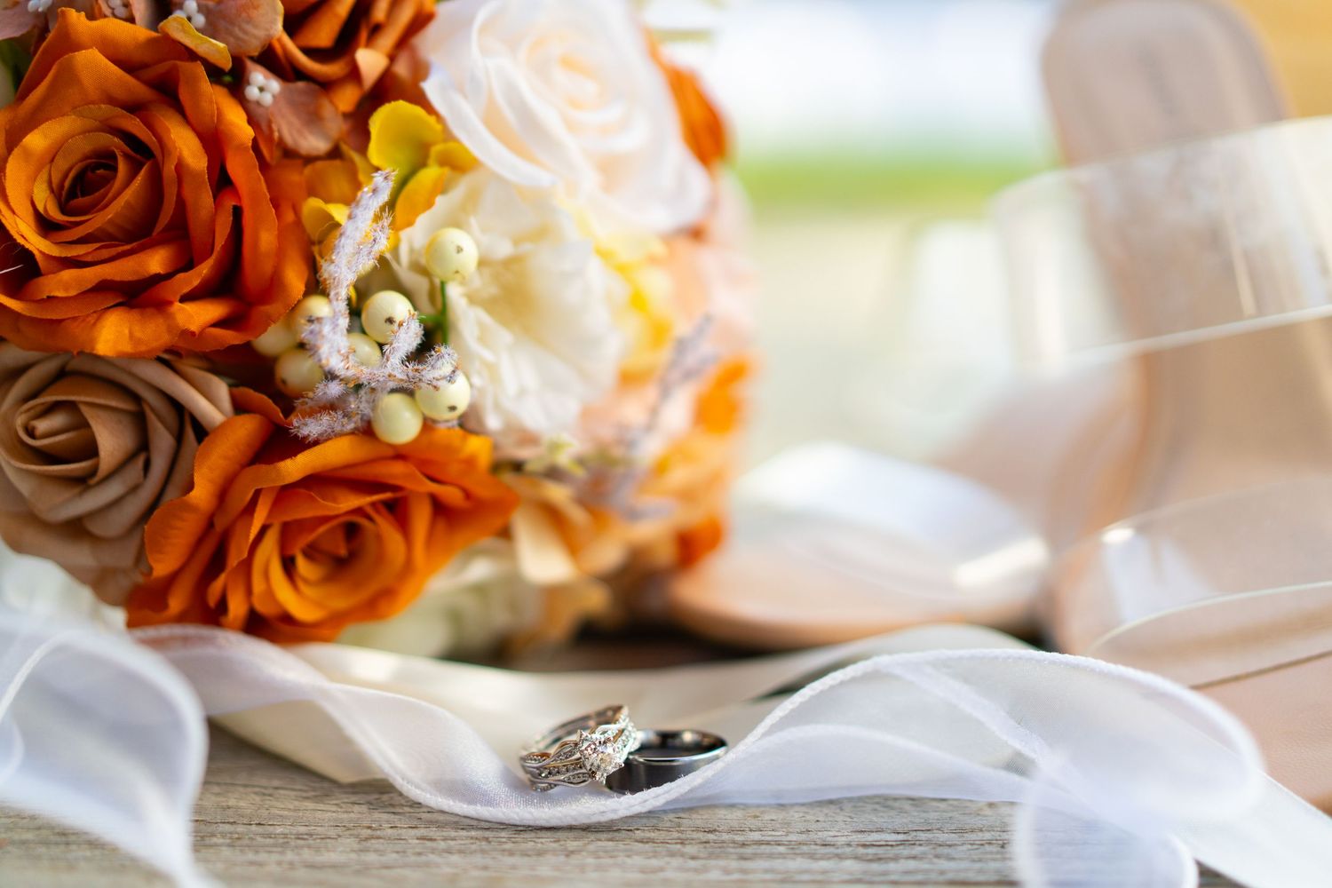 elegant wedding bouquets rest on white linen tablecloths at a reception- captured by Savvy Photography - Seattle Wedding Photographer
