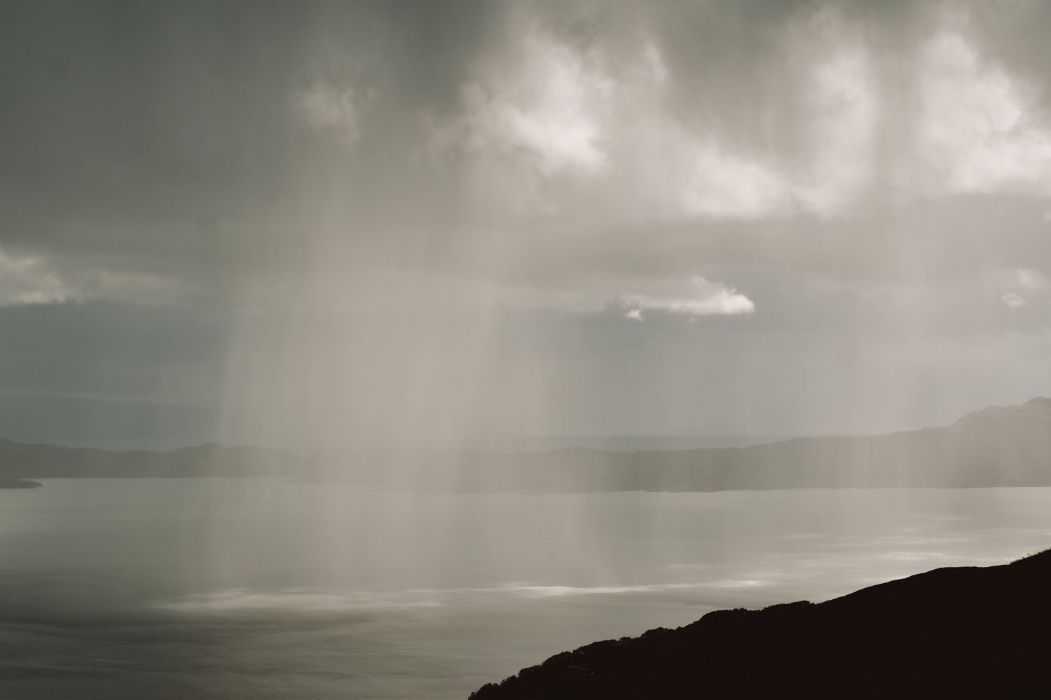 Landscape of rain falling on water
