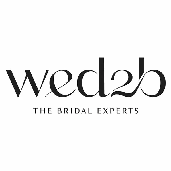 Black and white wedding dress boutique logo design with elegant text layout.