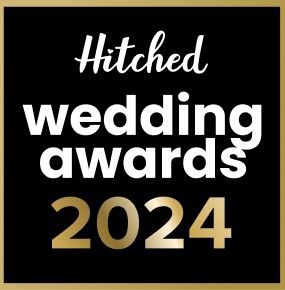 Black and gold 'Hitched Wedding Awards 2024' text design on a dark background.