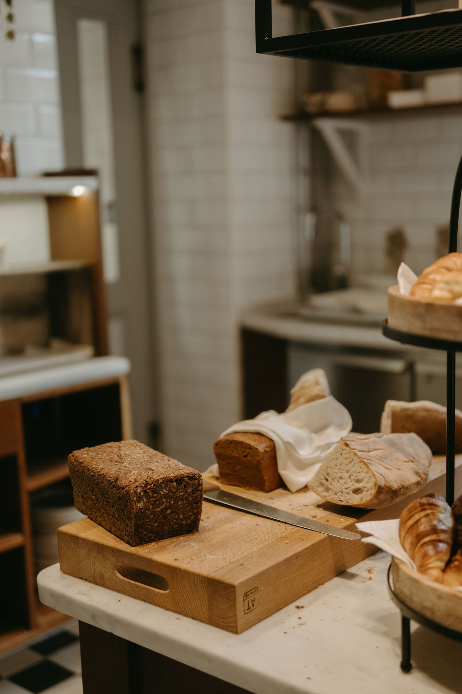 detail of bread and pastries in hotel kitchen being captured by lifestyle photographer in Stockholm
