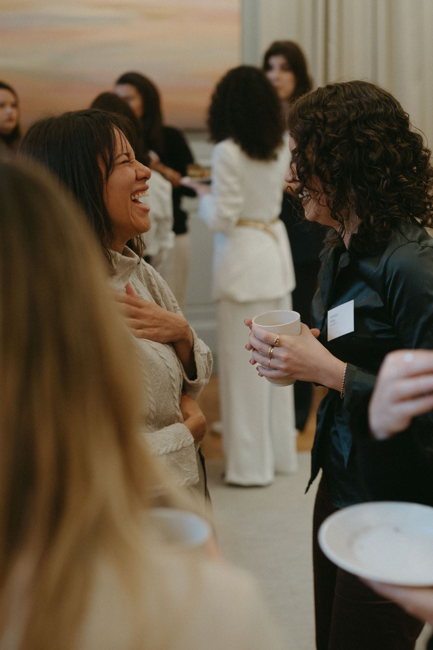 a woman laughing with her mouth open in an event while being captured by business photographer in Stockholm