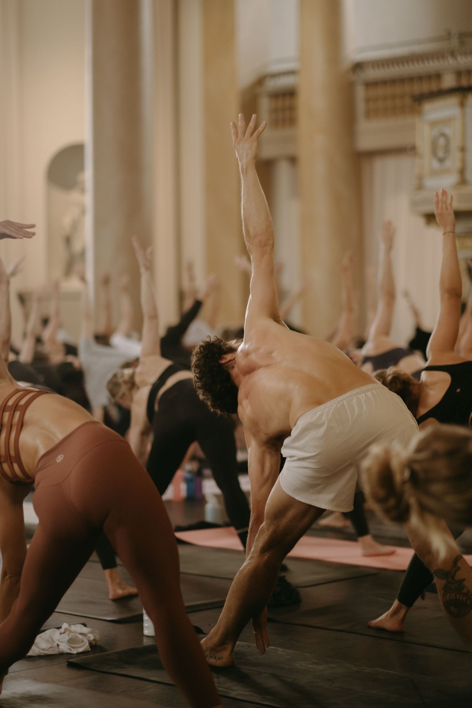 people doing yoga in church during yoga photoshoot in Stockholm