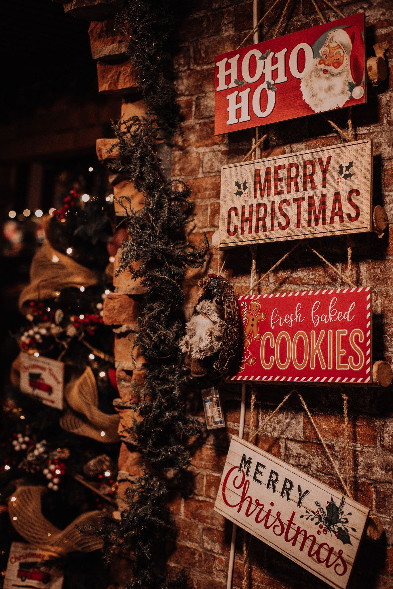 Rustic wooden Christmas signs displaying 