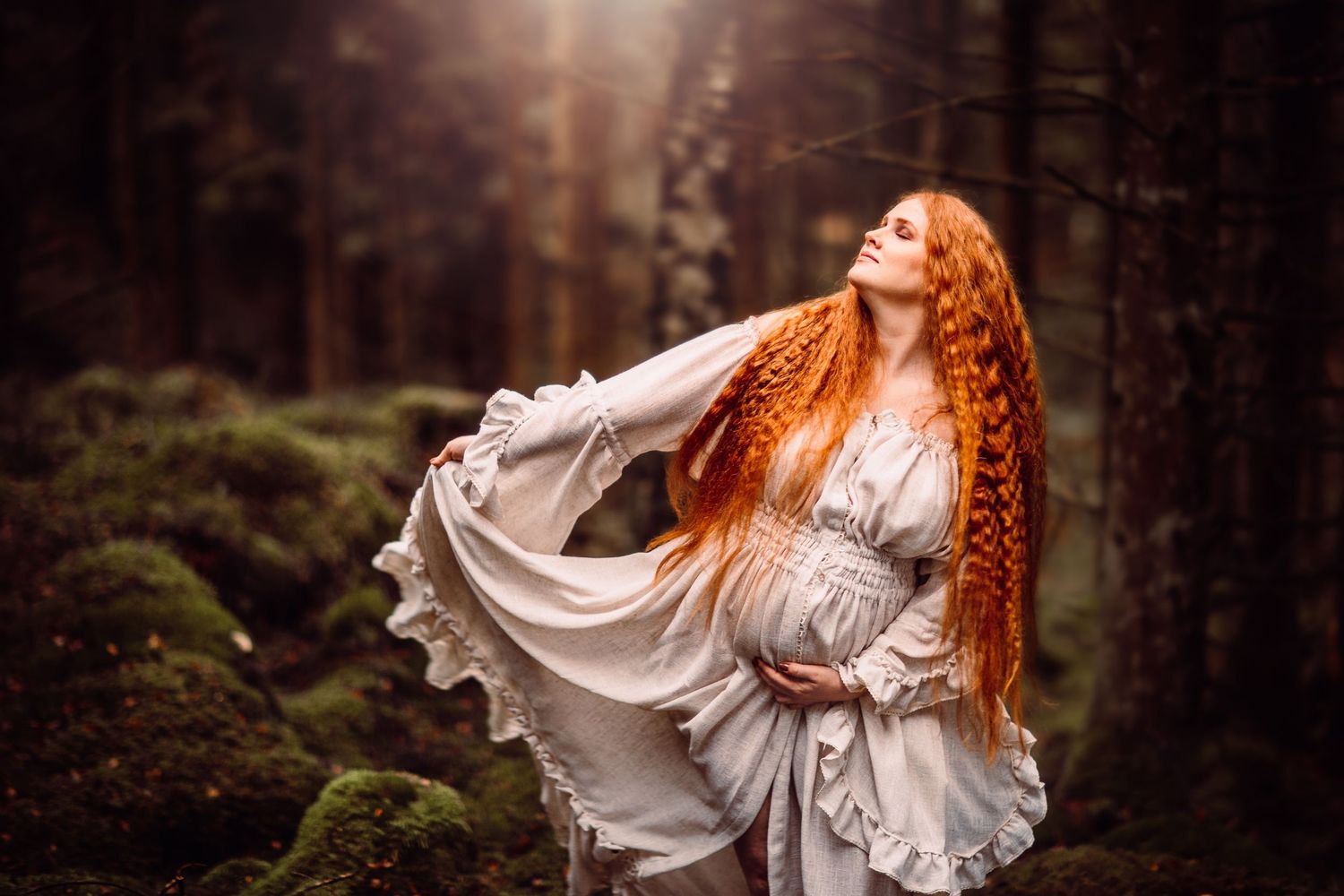 A woman in a flowing white dress dances in a mystical mossy forest, her long red hair catching the ethereal light.
