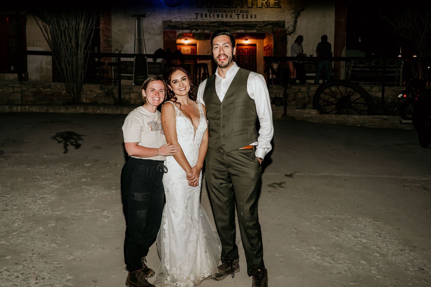 Wedding and elopement couple and their photographer at the end of the evening.