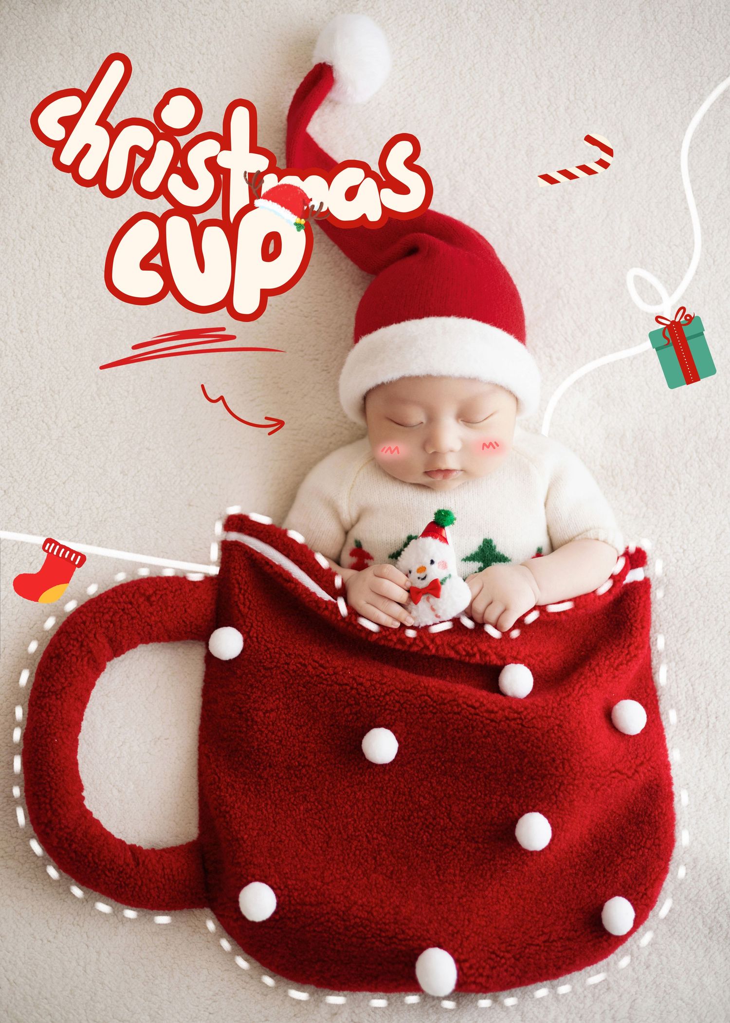 Sleeping newborn in Santa hat nestled inside a red Christmas cup prop with snowman toy.