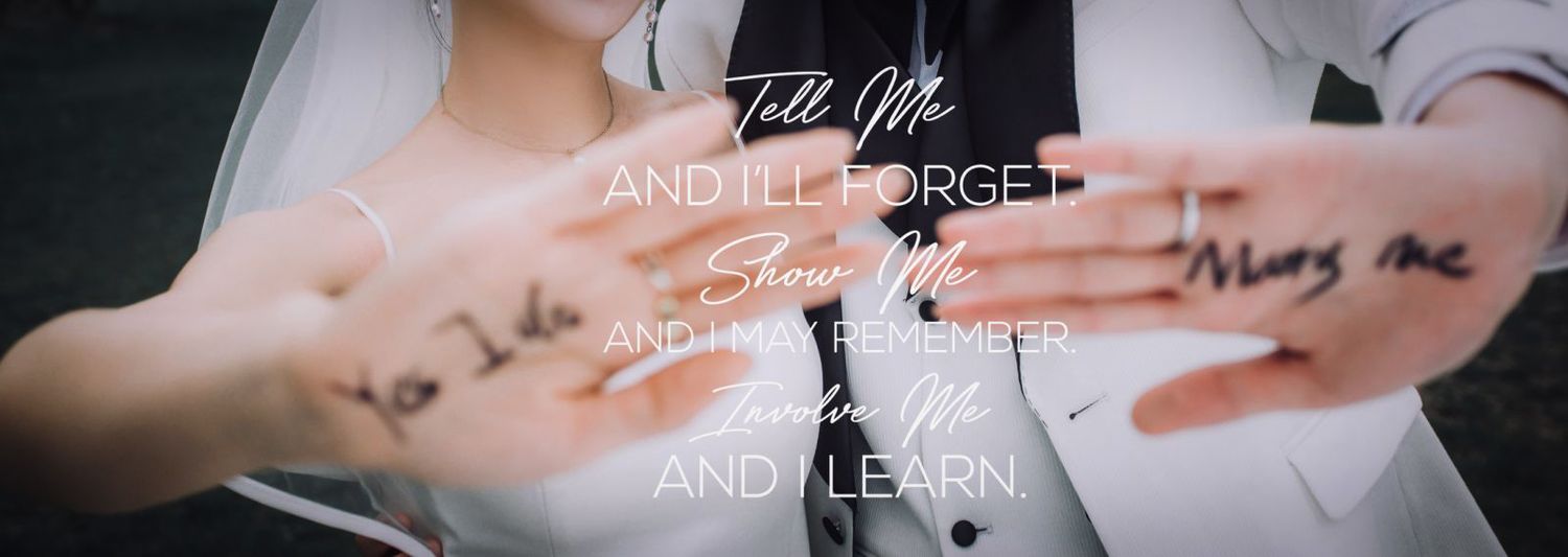 Hands with wedding vows written on them with quote overlay.