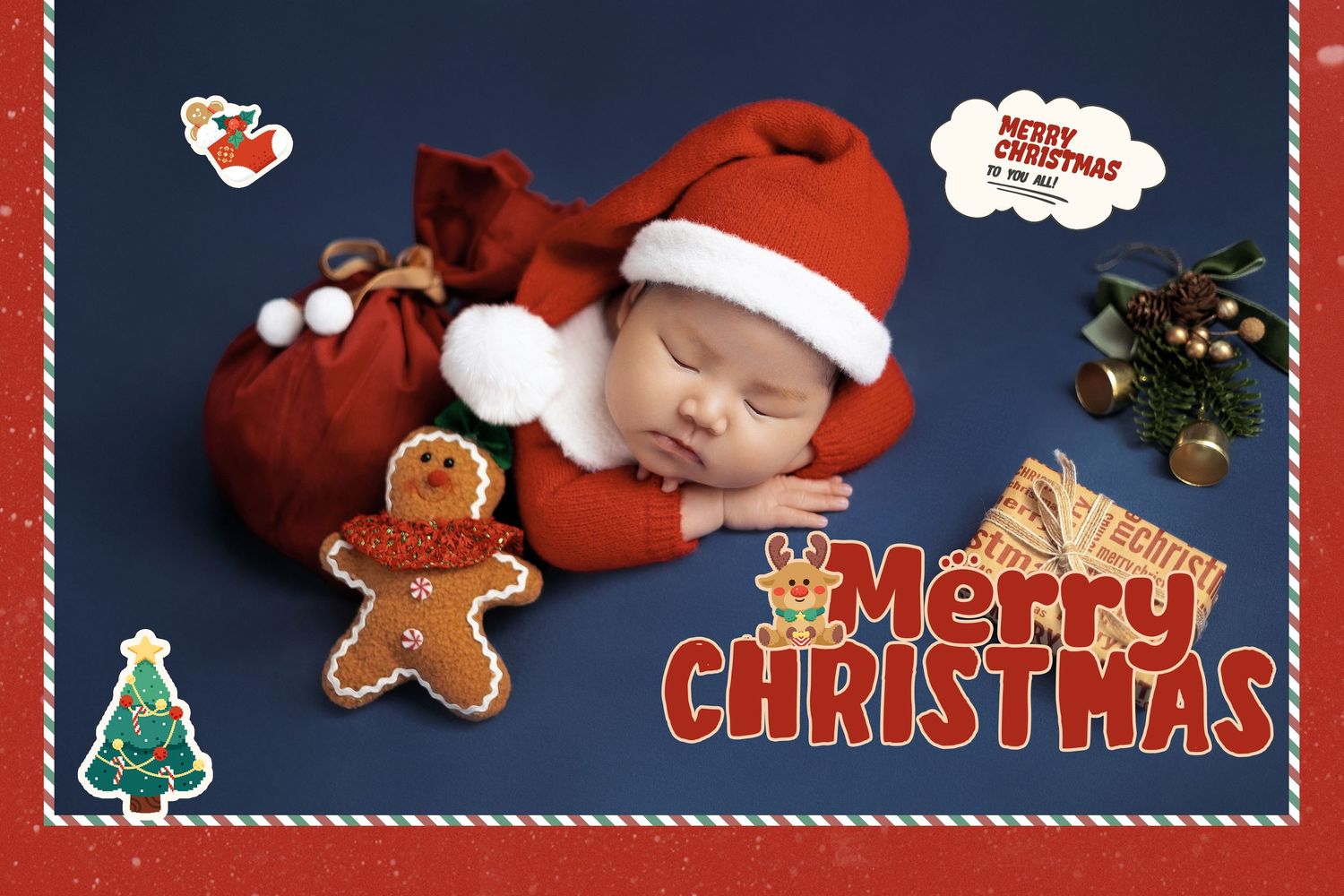 Sleeping newborn baby dressed in red Santa outfit with Christmas hat, surrounded by gingerbread man and holiday decorations.