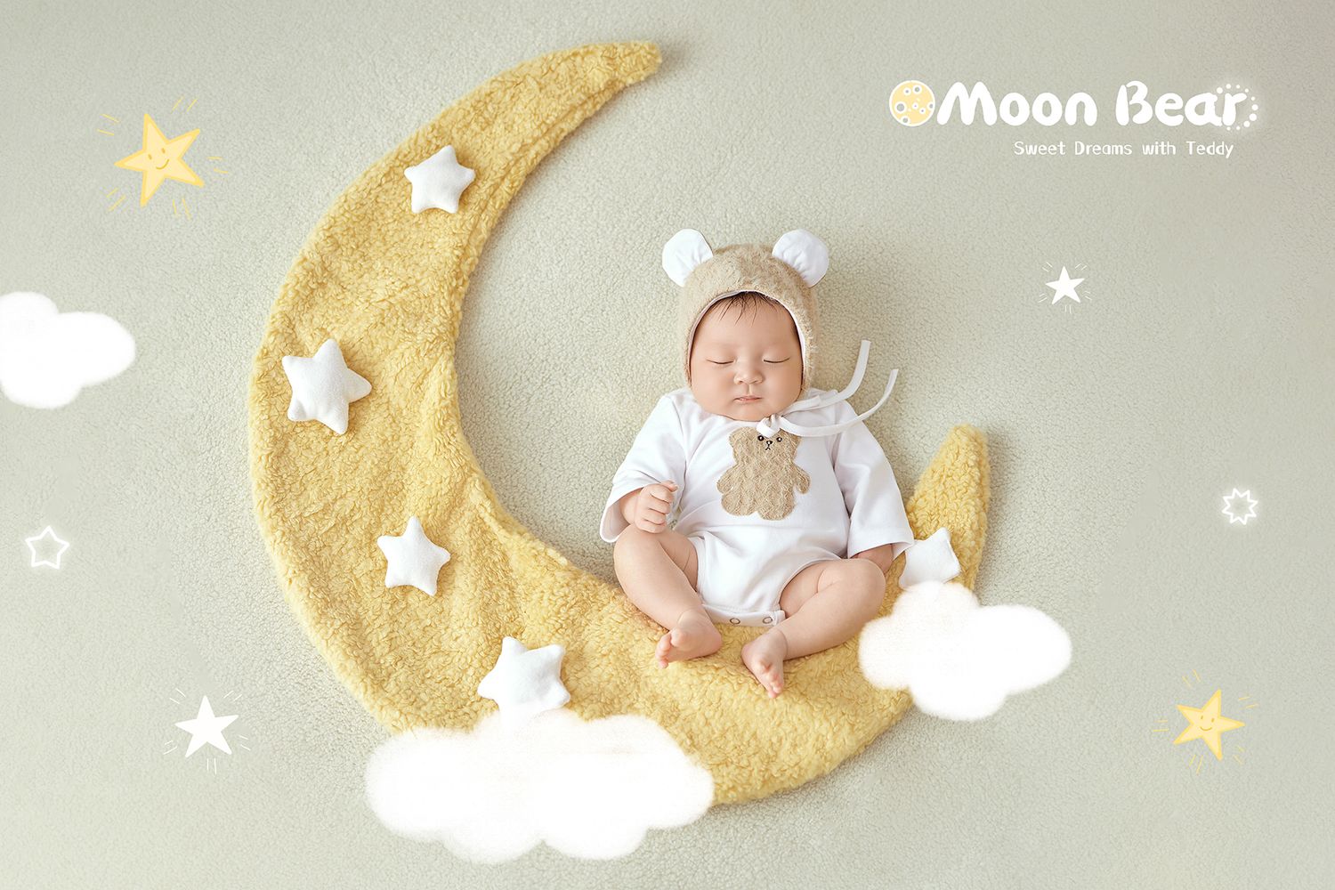 Newborn baby sleeping on a crescent moon prop wearing a bear bonnet in a whimsical Moon Bear themed photo.