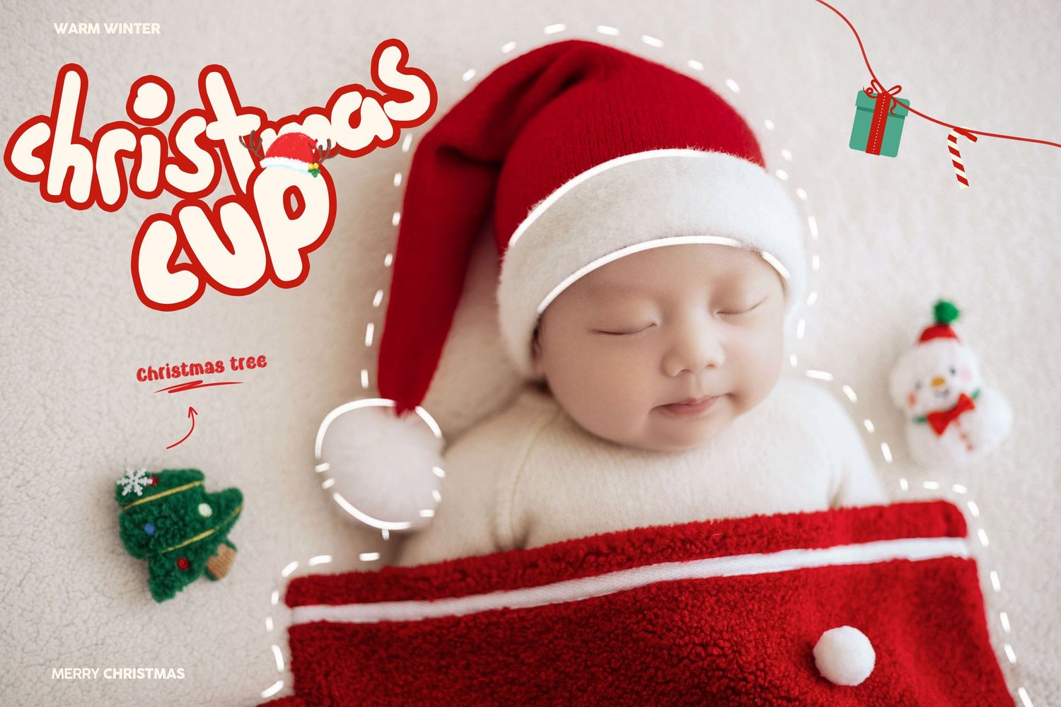 Baby in Santa hat sleeping beside red Christmas stocking with festive holiday decorations around them.