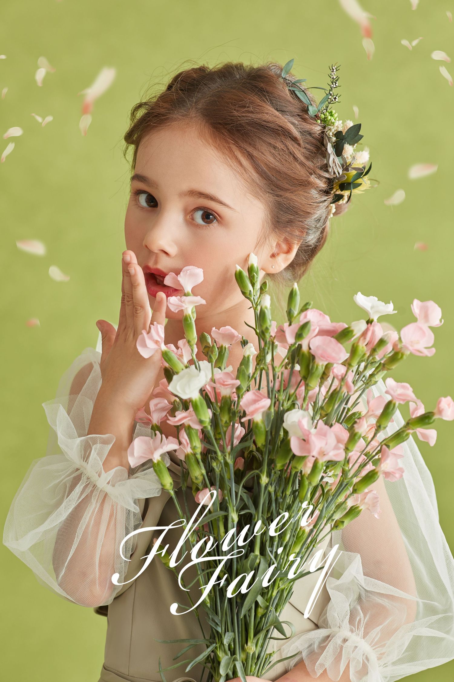 Surprised young girl with floral hair accessory holds pink carnations in green setting.