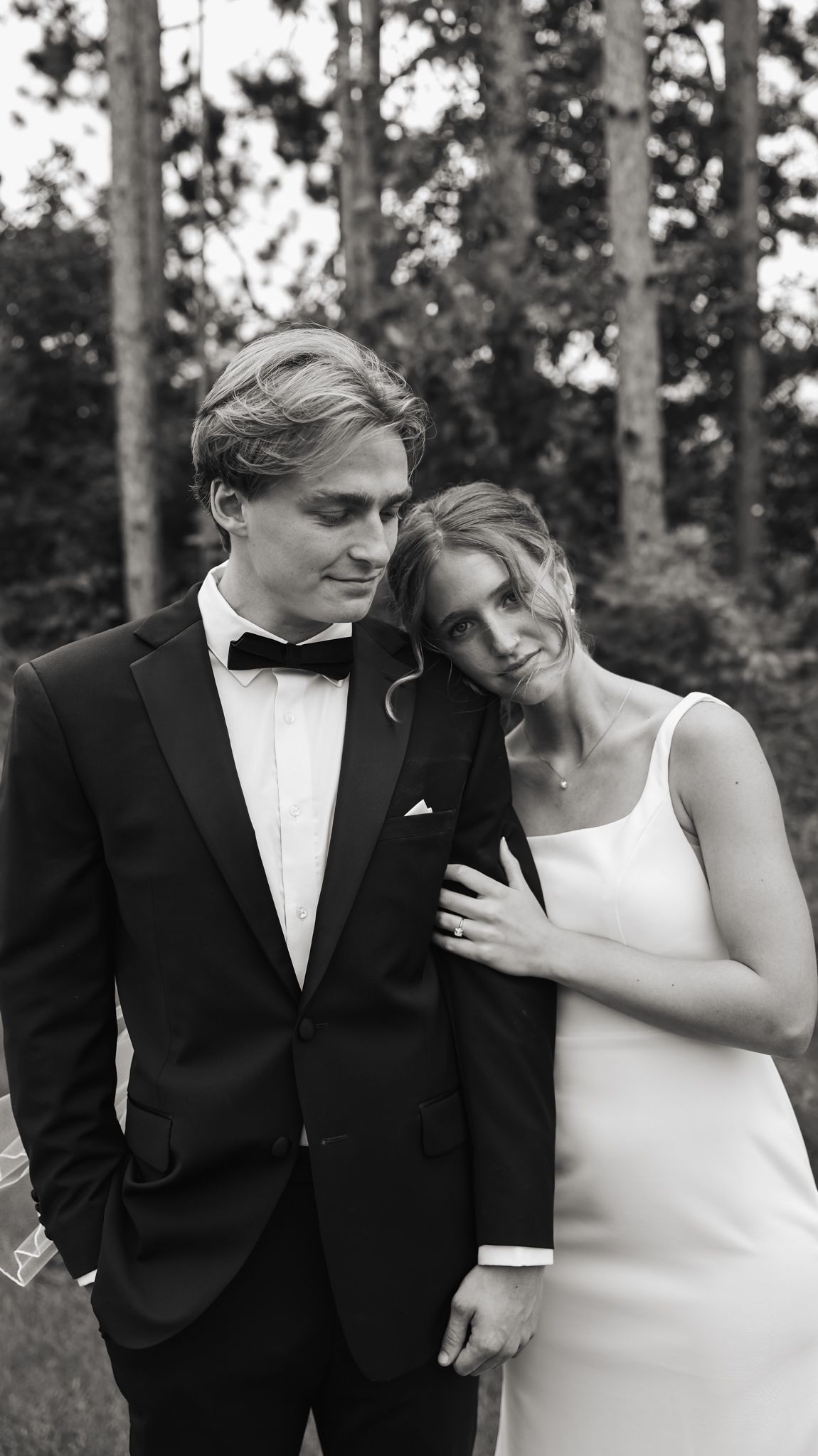 Romantic wedding portraits captured in natural woodland setting.