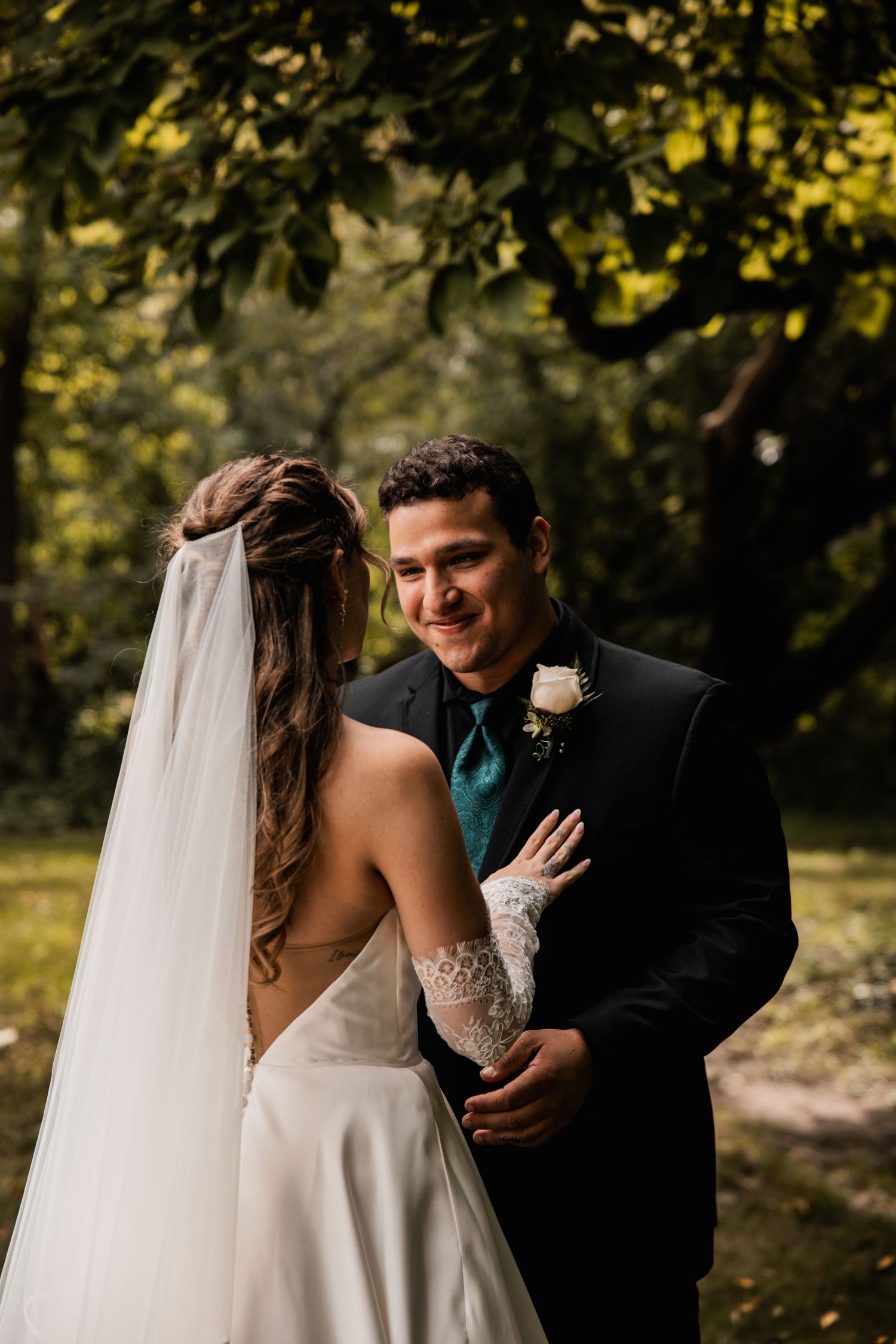 Wedding couple shares joyful moments together during an outdoor autumn photo session.