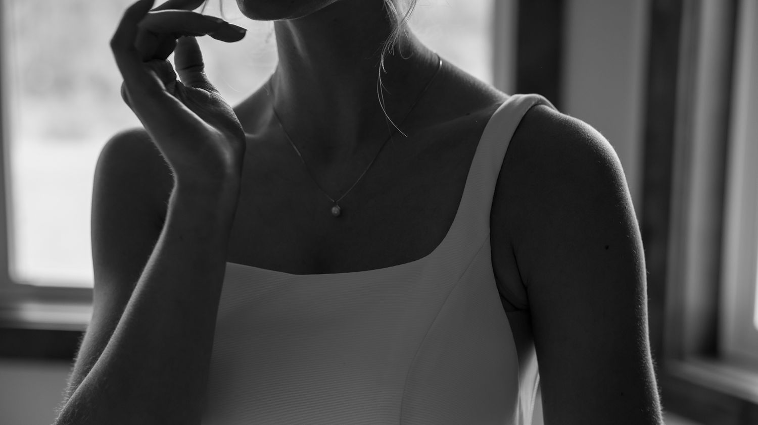 Black and white portrait series showing formal attire and elegant poses.