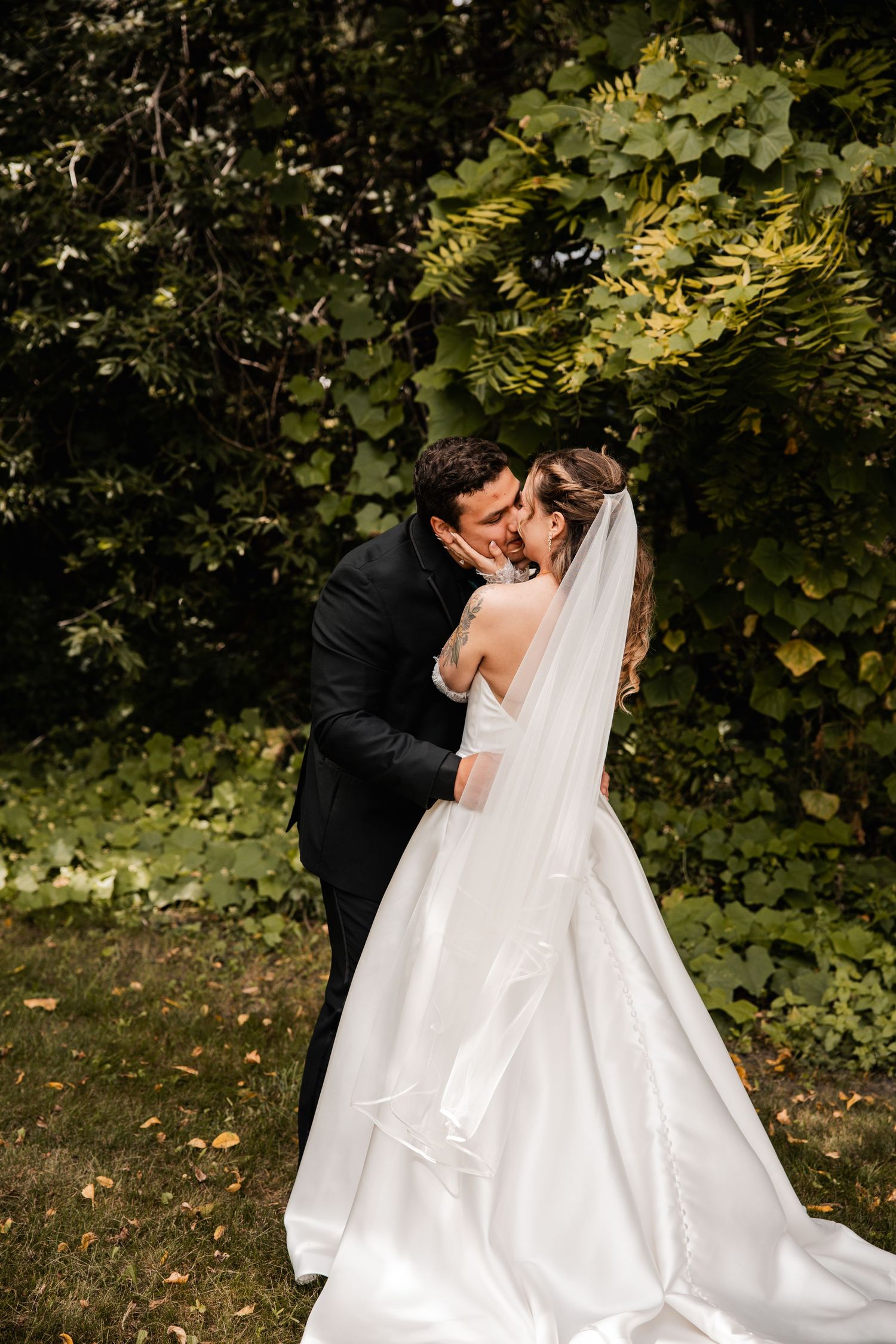 Wedding photography sequence capturing romantic moments between newlyweds in a natural forest setting.