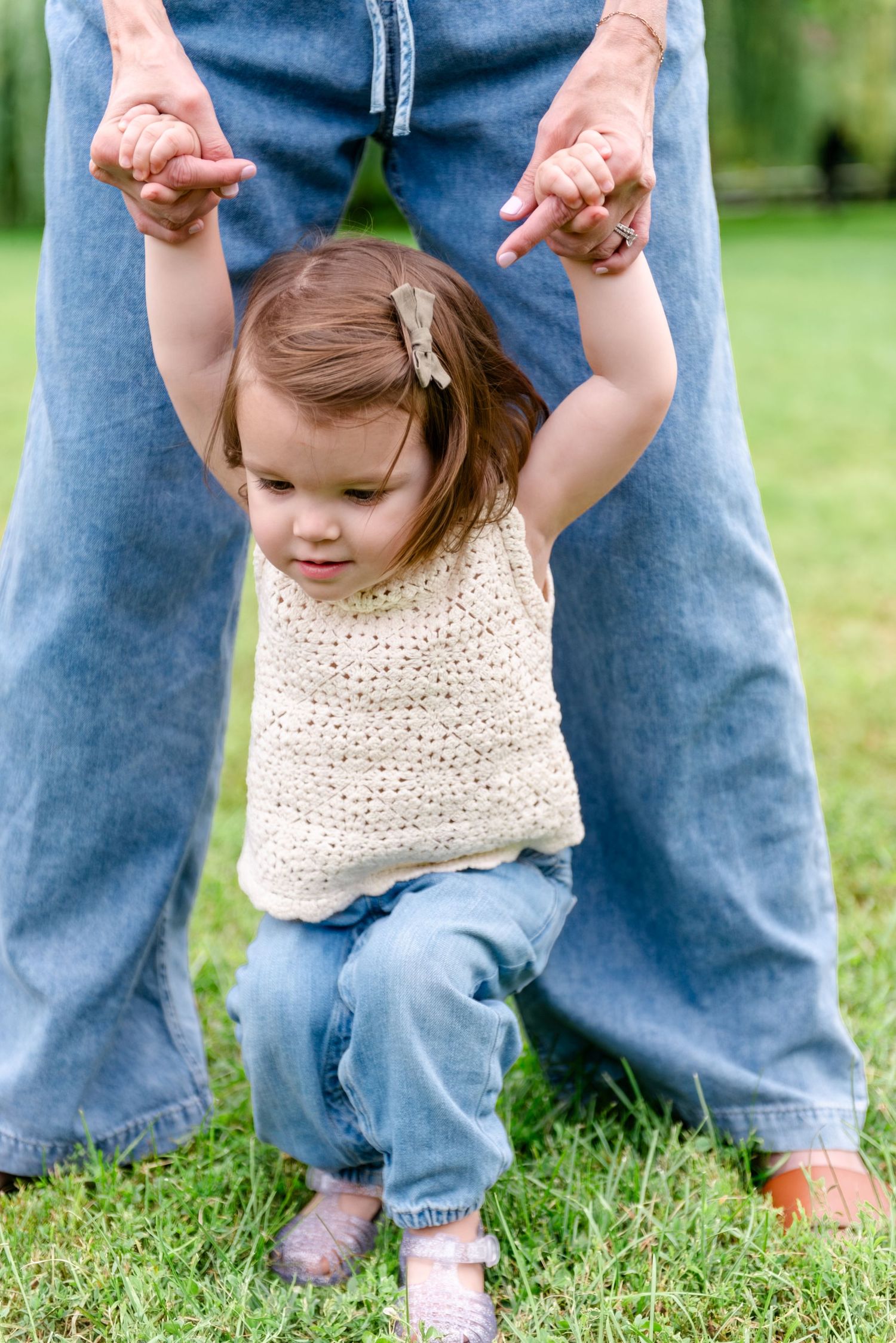 Toddler playing during lifestyle family shoot in park