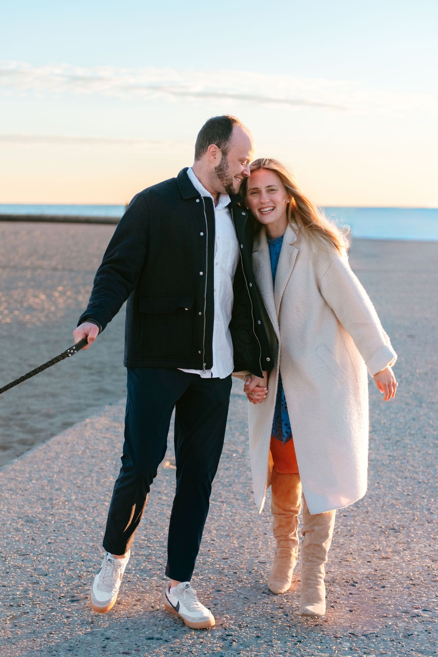 Chicago couples portrait of engaged couple laughing during lifestyle session