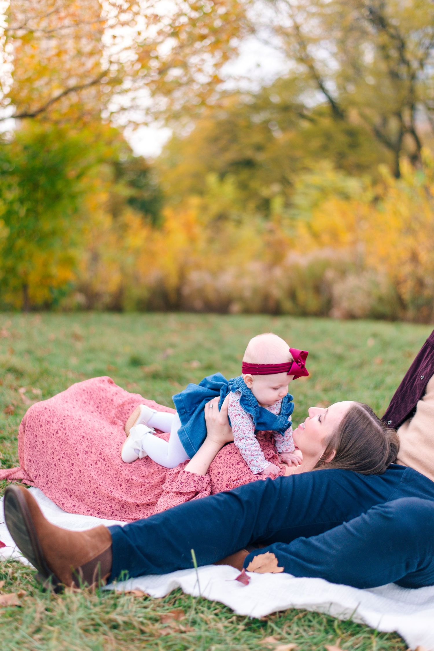 Mother cradling newborn during quiet lifestyle portrait session