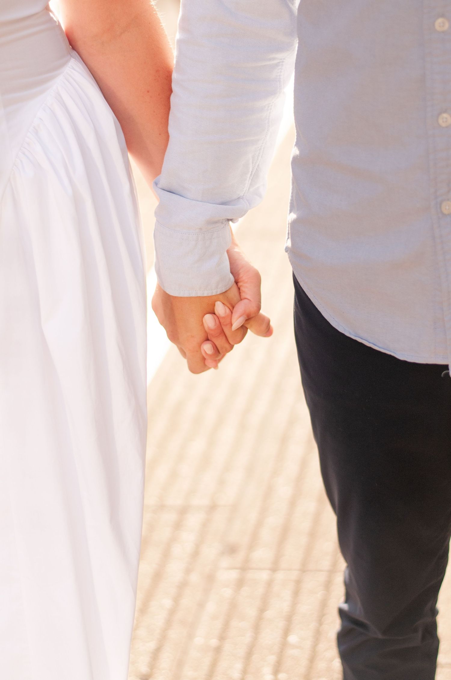 Couple holding hands during engagement session in downtown Chicago