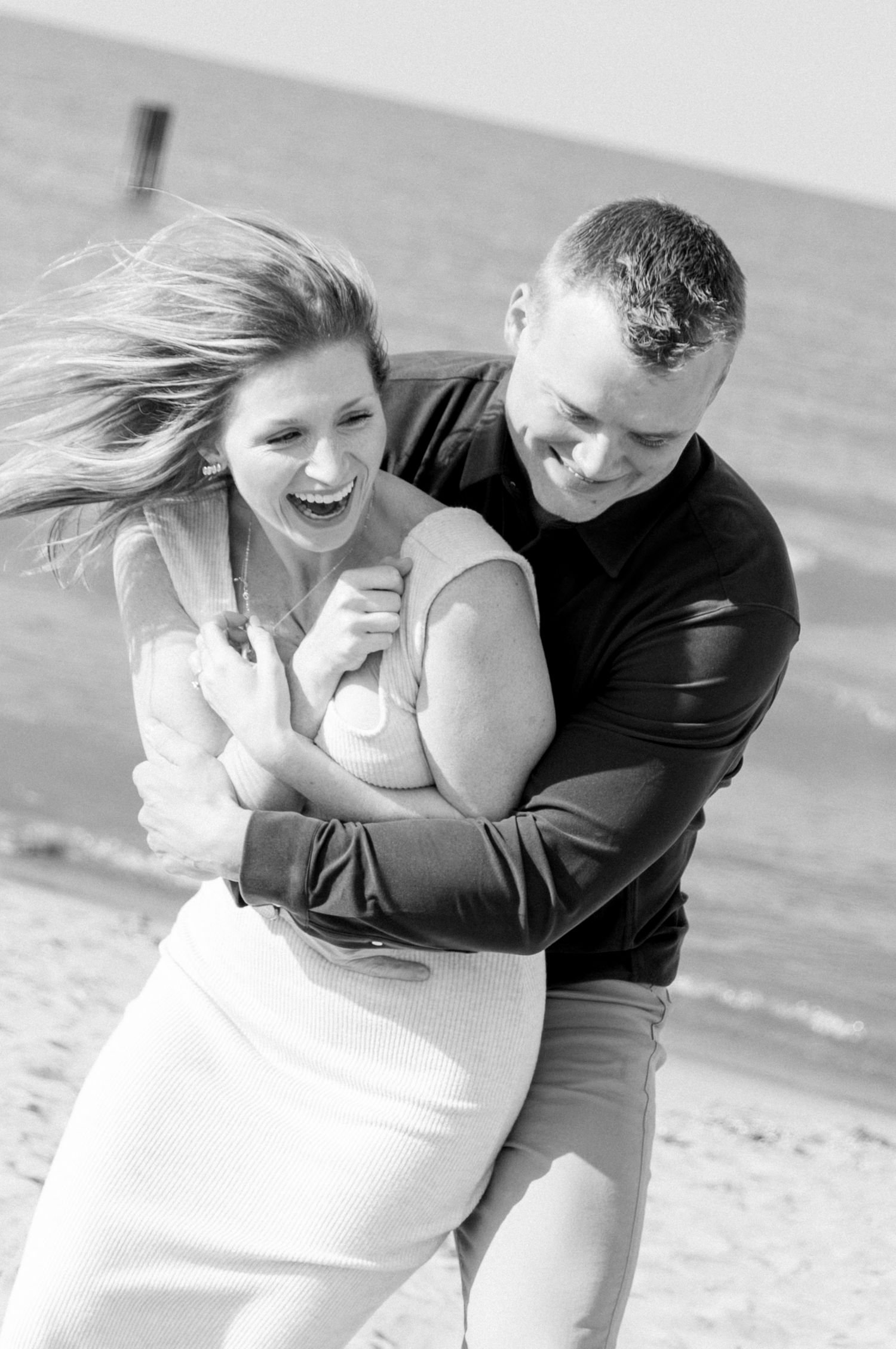 Couple laughing together during documentary-style portrait session
