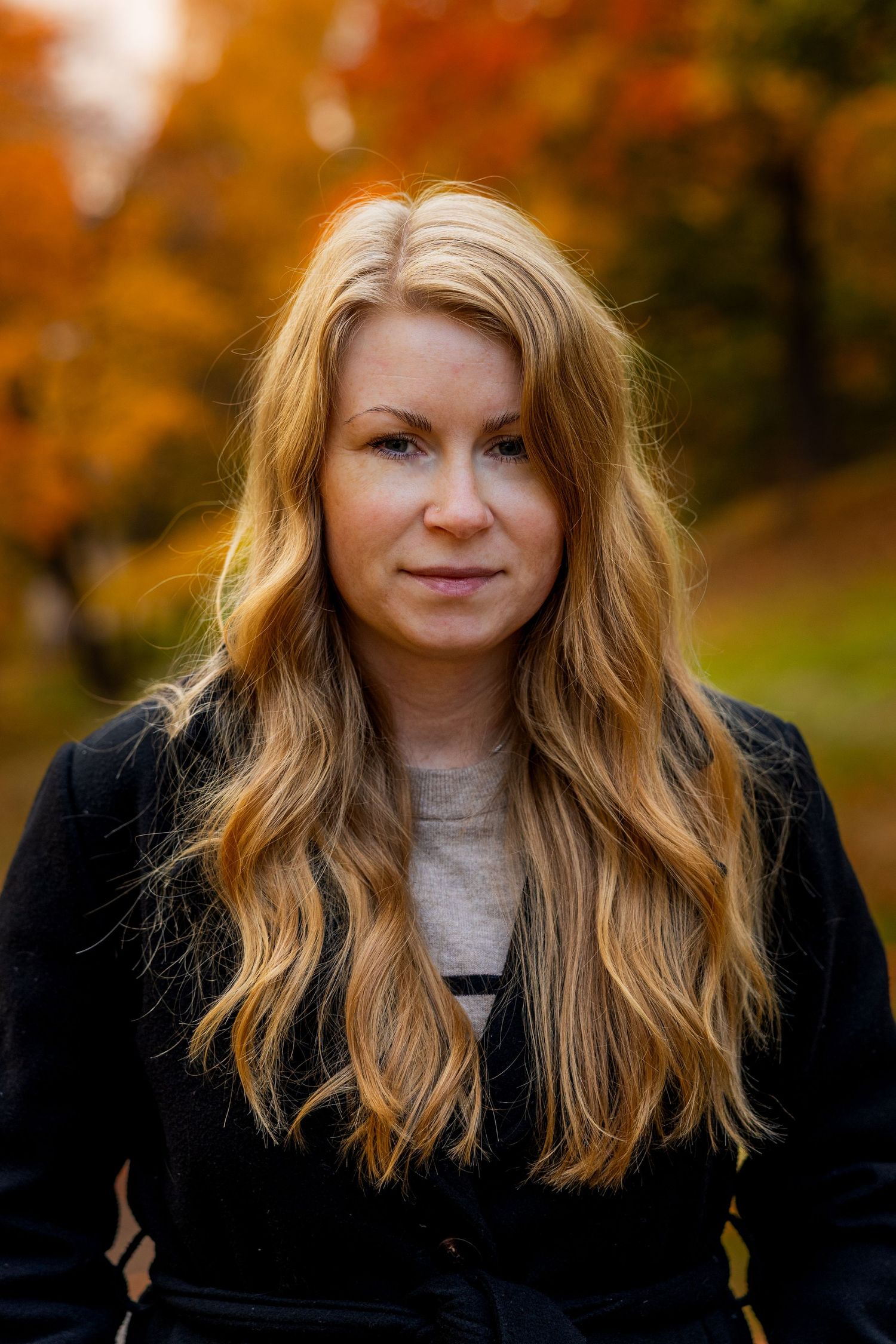 Portrait series with autumn foliage creating a warm seasonal backdrop.