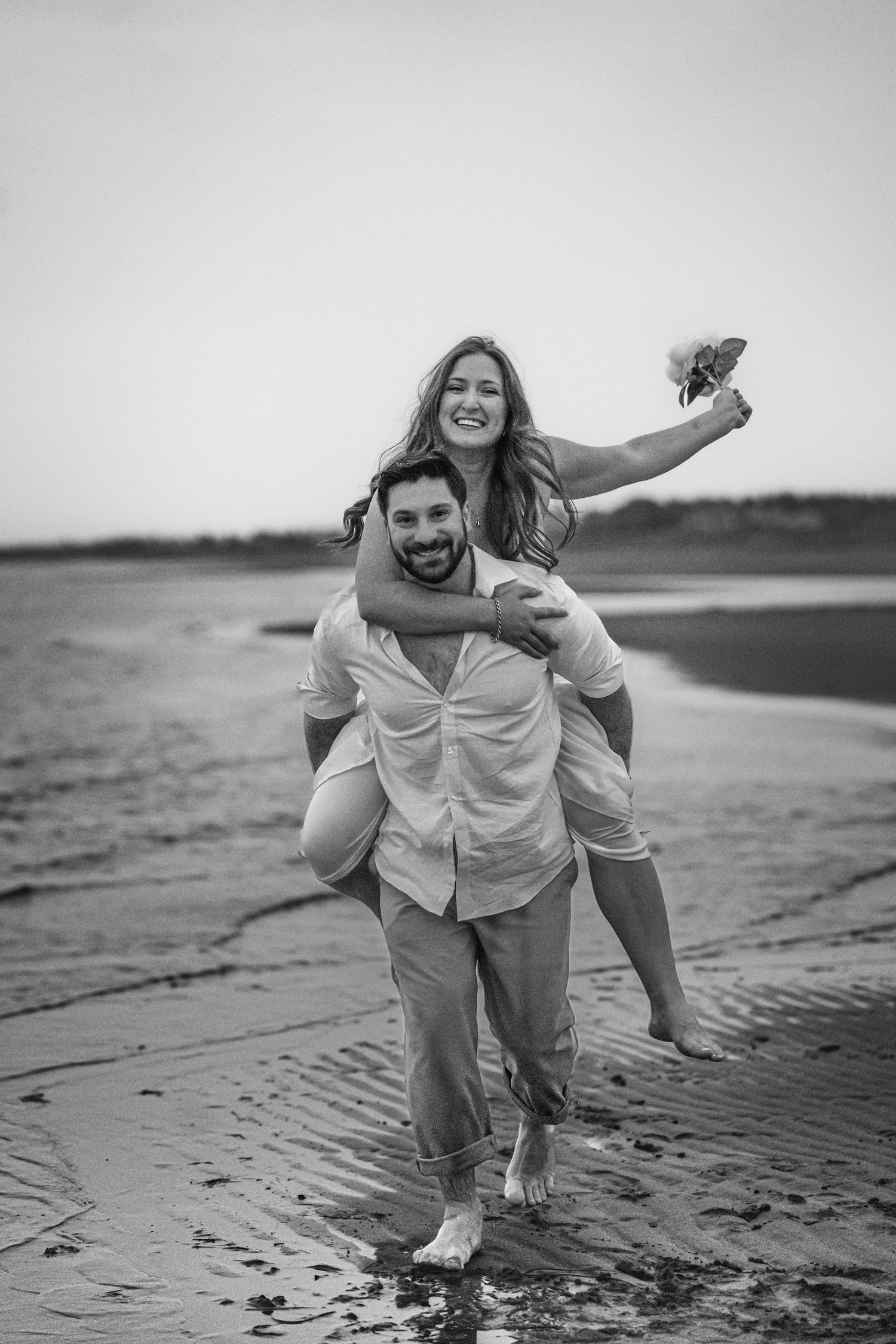 Romantic couple intimate during a golden hour engagement session in beach in Moncton, NB.