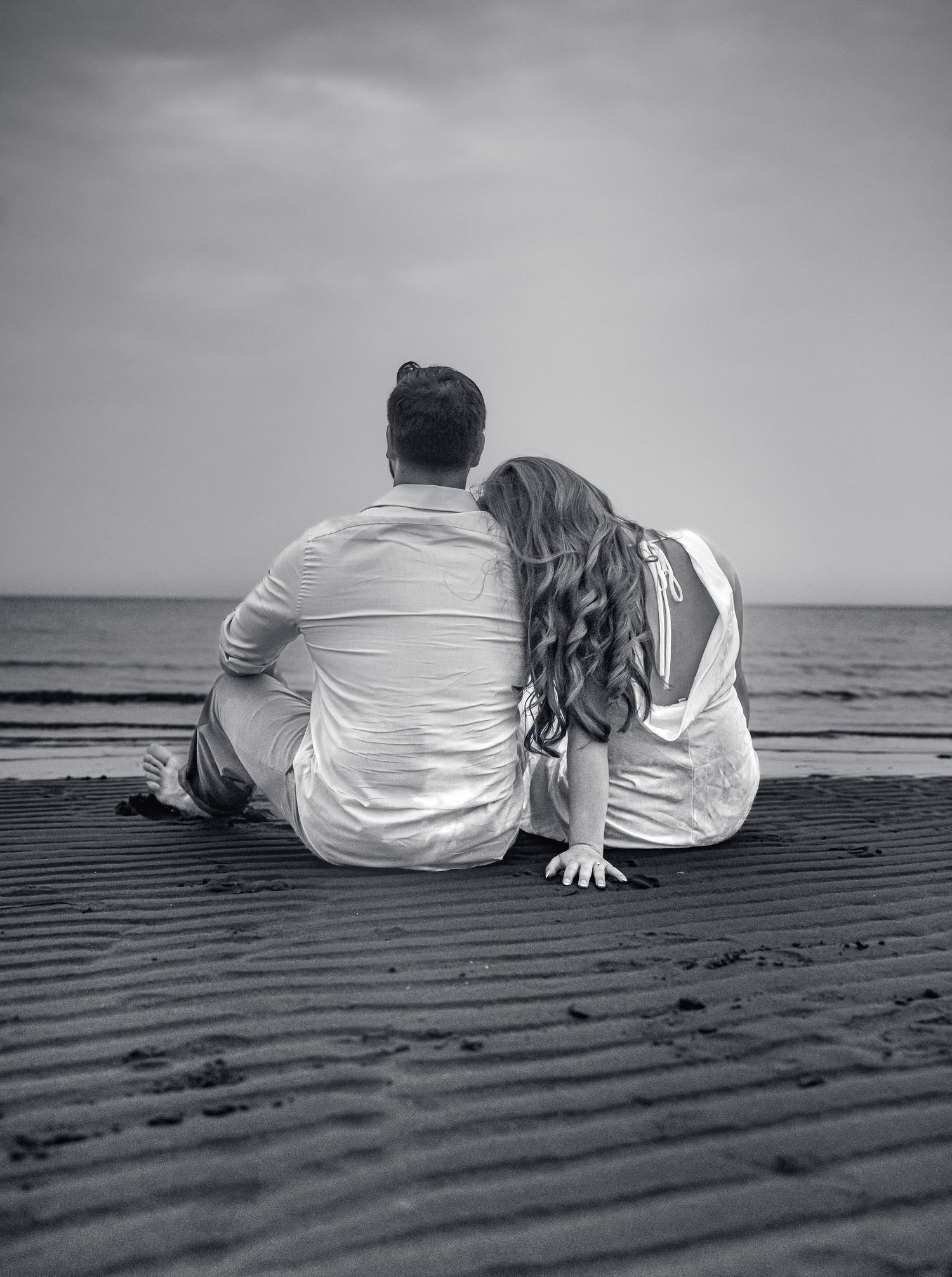 Romantic couple intimate during a golden hour engagement session in beach in Moncton, NB.