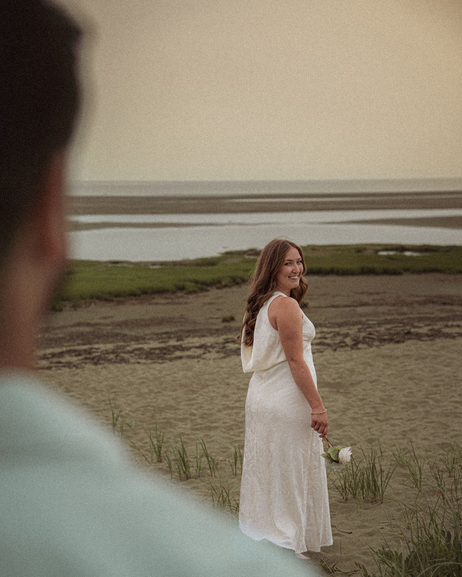 Romantic couple proposal during a golden hour engagement session in beach in Moncton, NB.