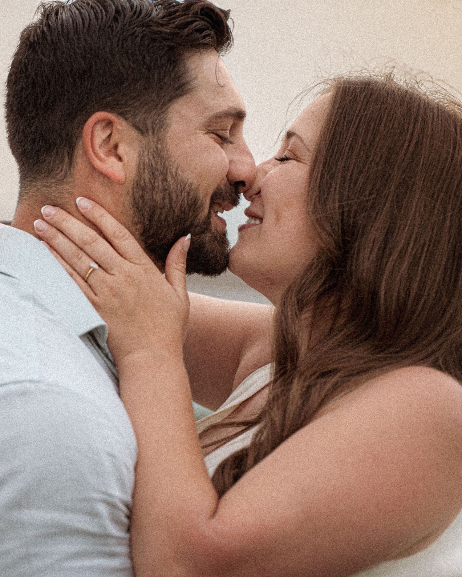 Romantic couple kissing a golden hour engagement session in beach in Moncton, NB.