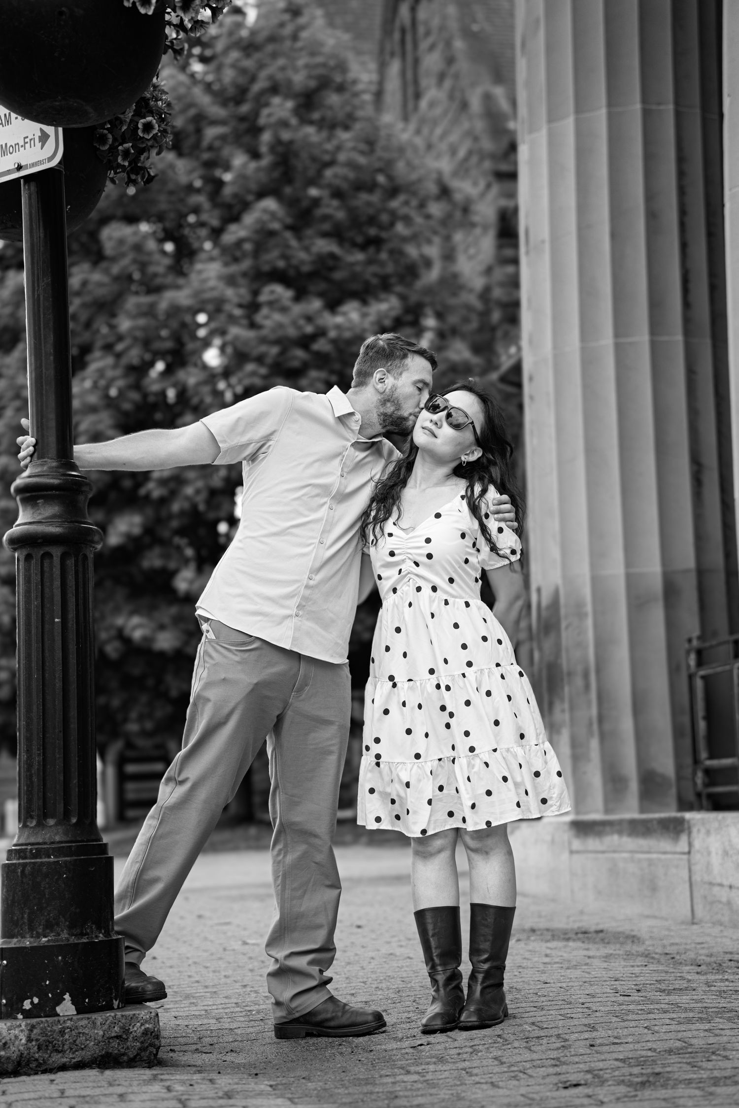 Romantic couple kissing during a engagement session in downtown in Moncton, NB. Engagement city shoot