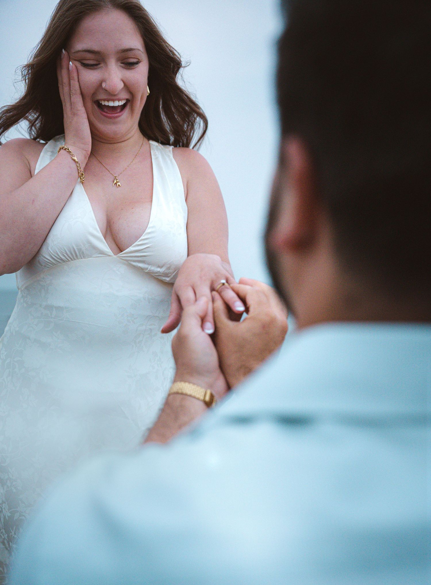 Romantic couple proposal during a golden hour engagement session in beach in Moncton, NB. Engagement beach shoot